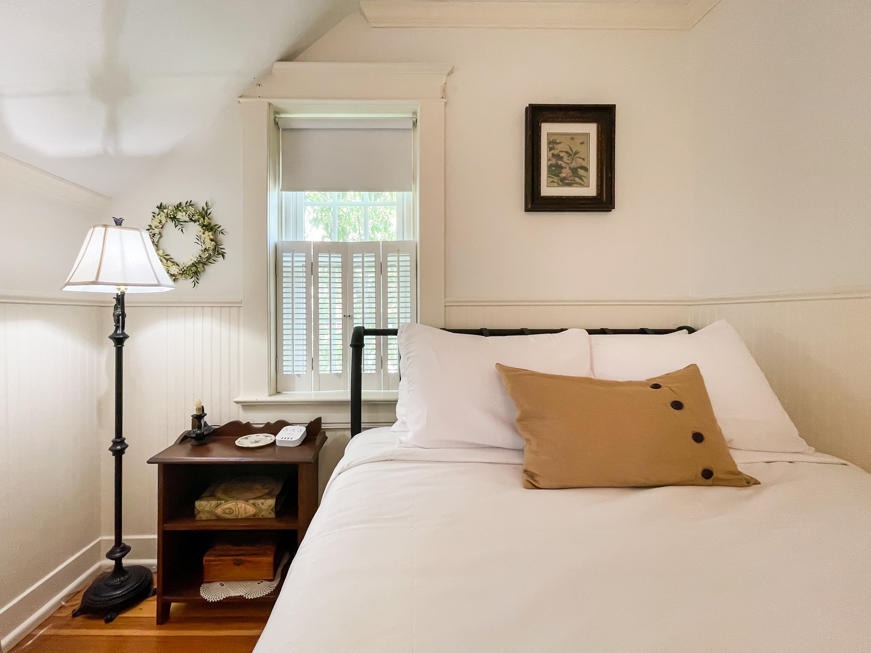 The cozy 3rd bedroom has a queen size bed with crisp white linens and share the second full bathroom with gorgeous clawfoot tub at The Beekeeper's Cottage.
