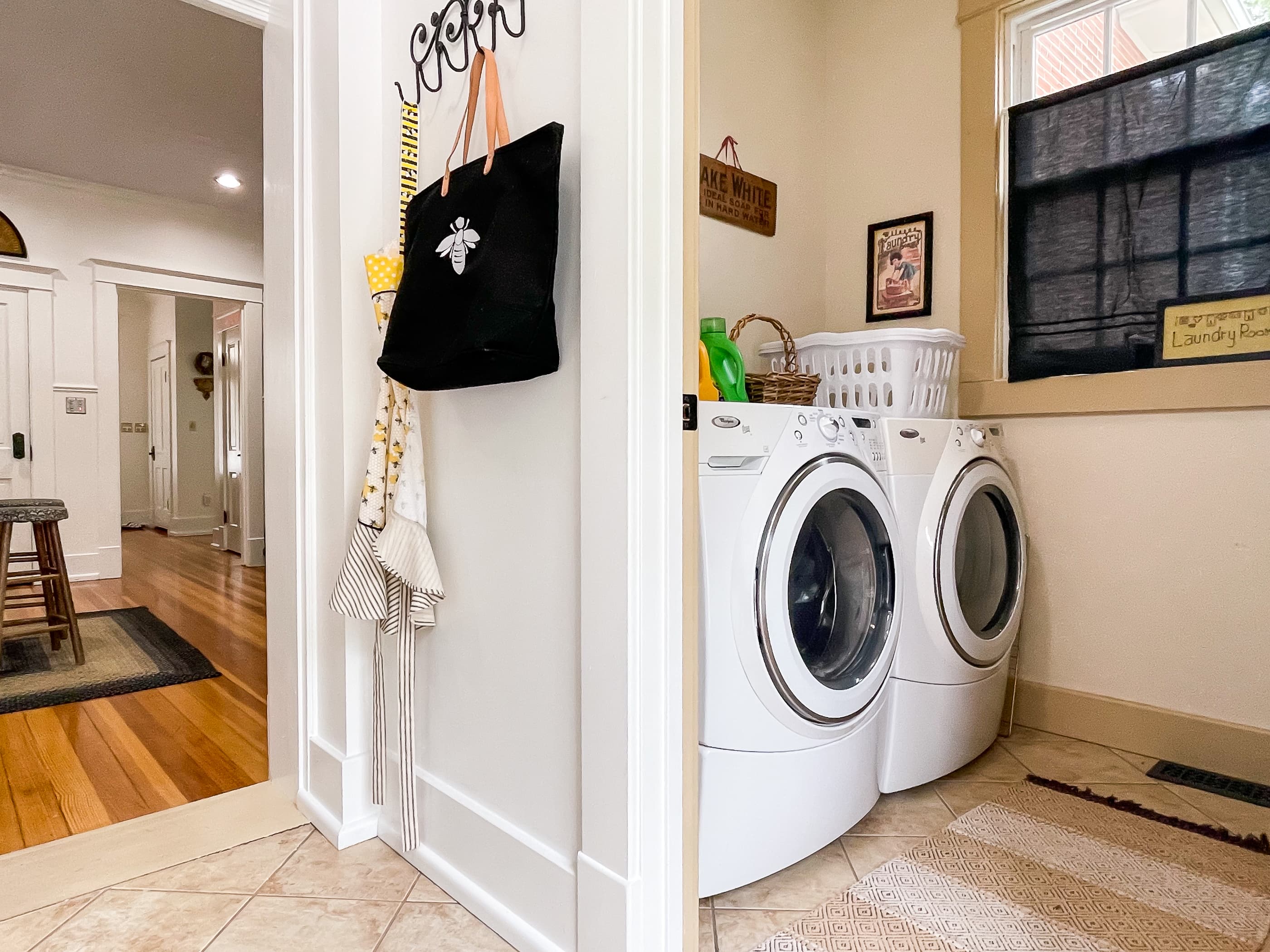 The set of front loading washer and dryer is located off the kitchen by the back door at The Beekeeper's Cottage.