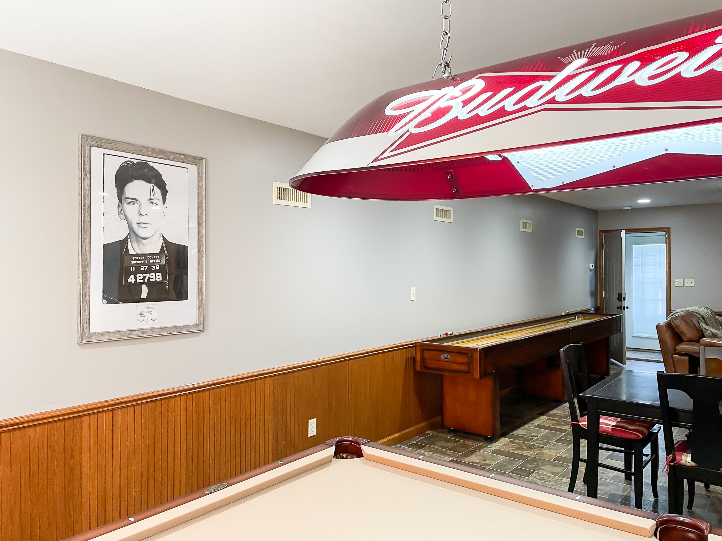OPTIONAL ADD ON: Beekeepers Cottage Garage upper level game room with professional size pool table, shuffle board, flat screen Smart TV and comfy leather furniture great for game or movie night with family and friends.