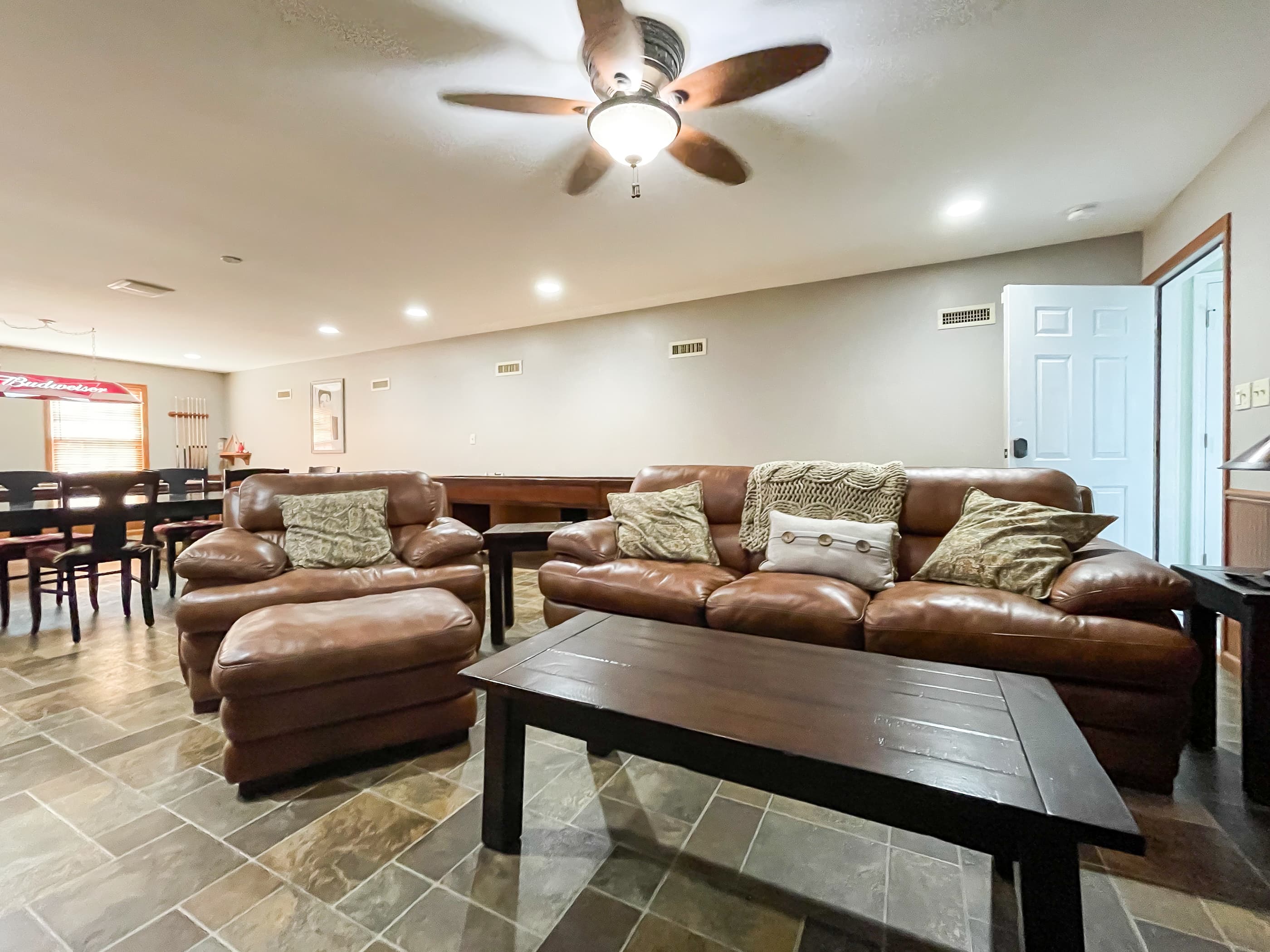 OPTIONAL ADD ON: Beekeepers Cottage Garage upper level game room with professional size pool table, shuffle board, flat screen Smart TV and comfy leather furniture great for game or movie night with family and friends.