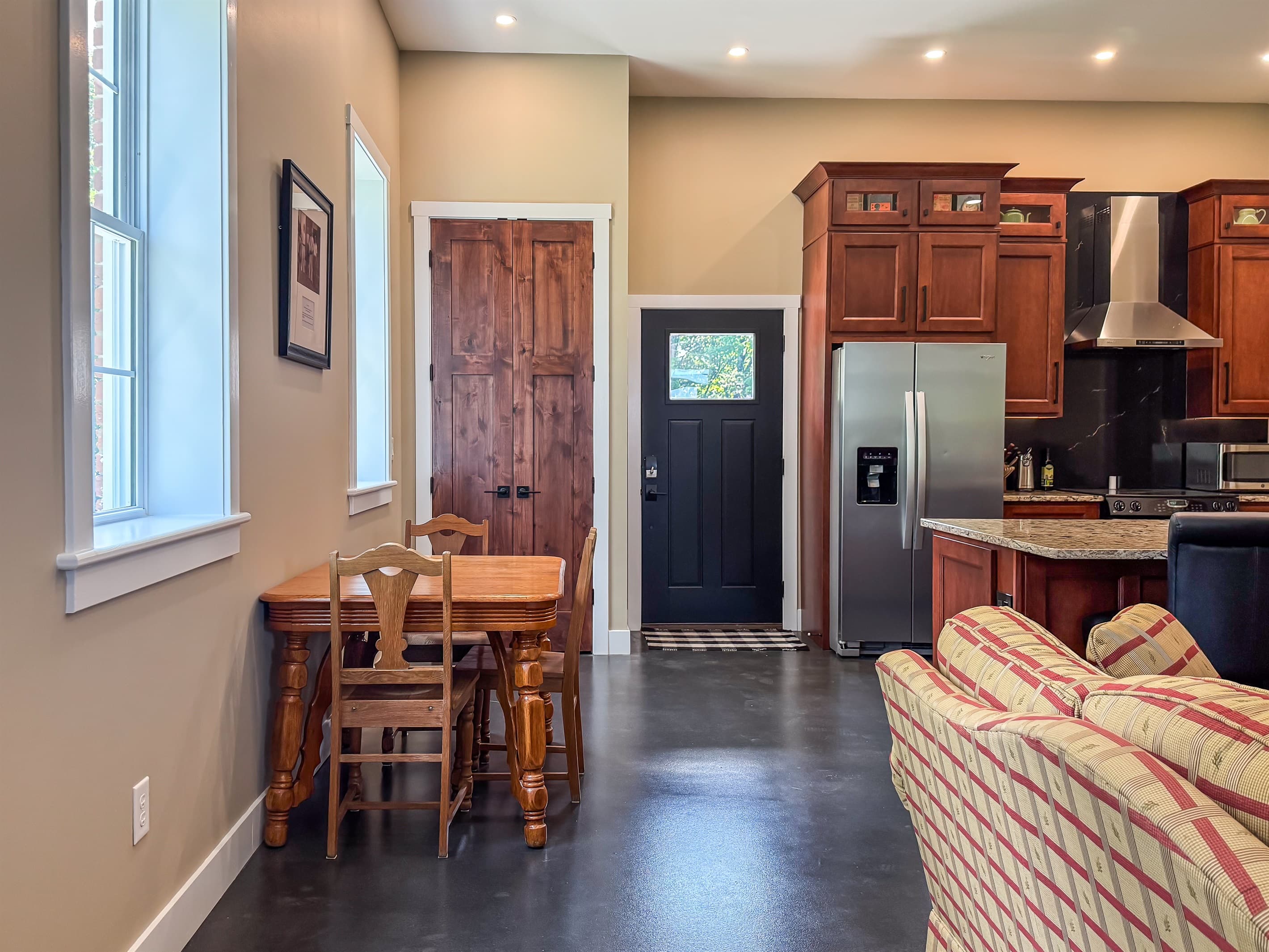 Open concept dining and living area with main level entry at Pikes Peak Schoolhouse.