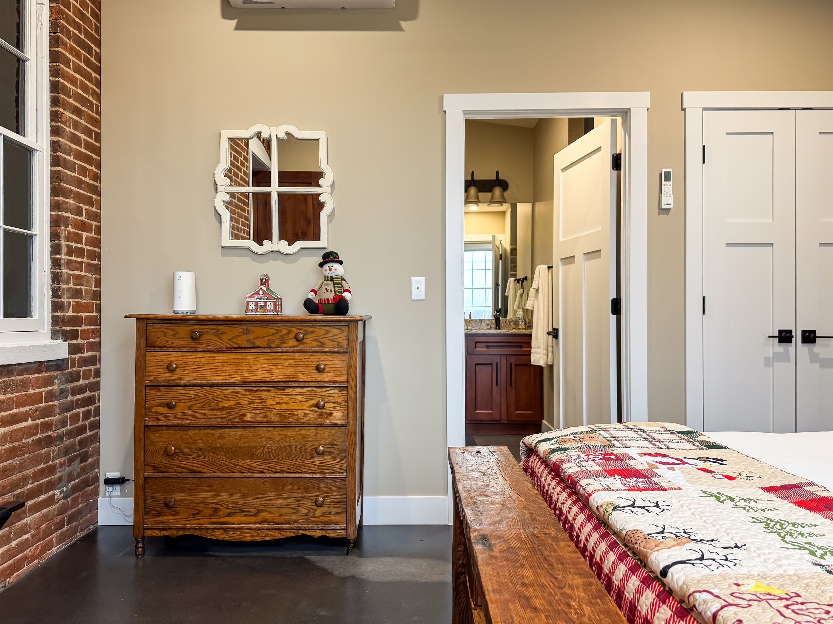 Ample clothing and walking room with bathroom access in the bedroom at Pikes Peak Schoolhouse.