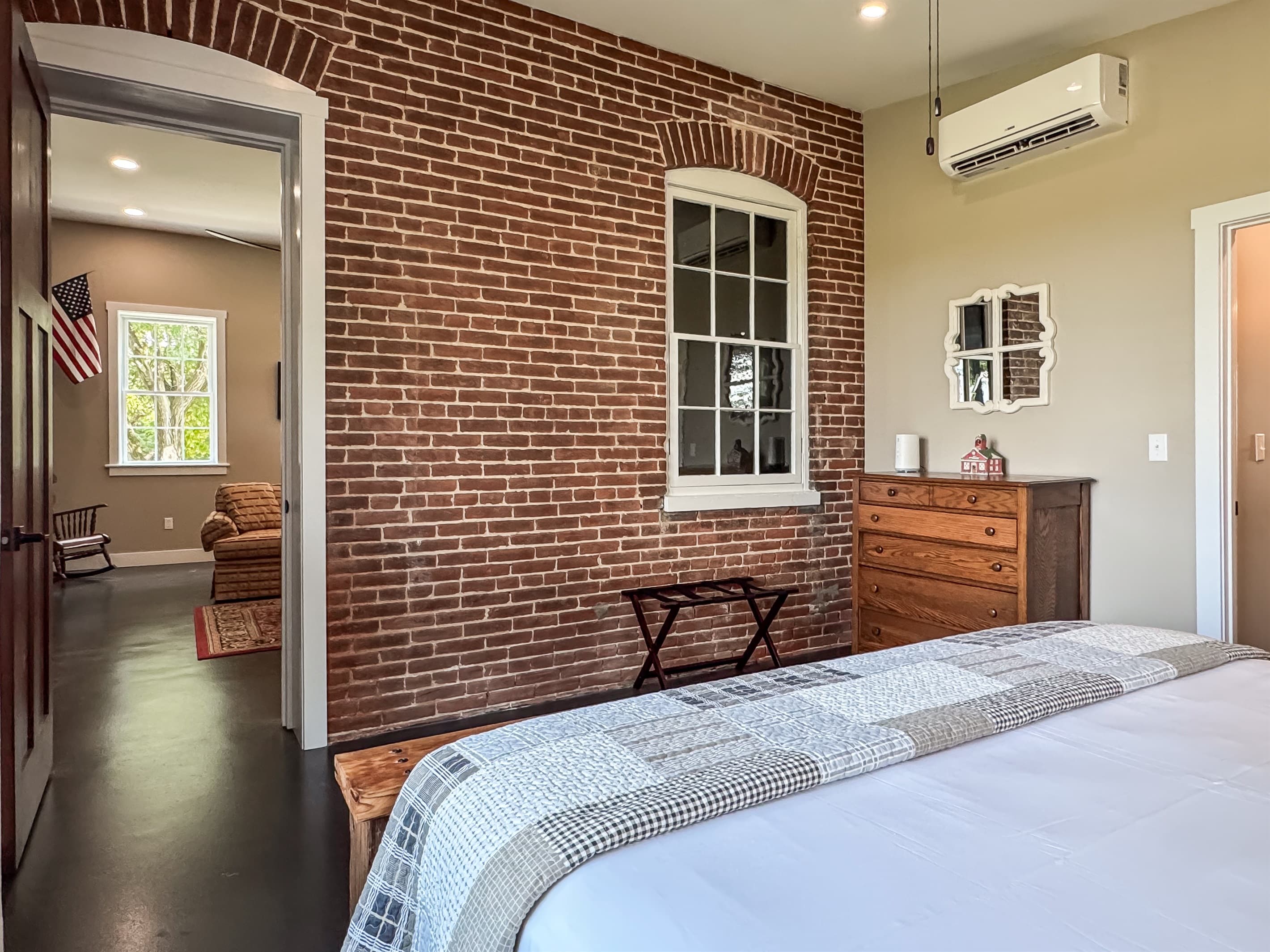 Ample clothing and walking room with bathroom access in the bedroom at Pikes Peak Schoolhouse.