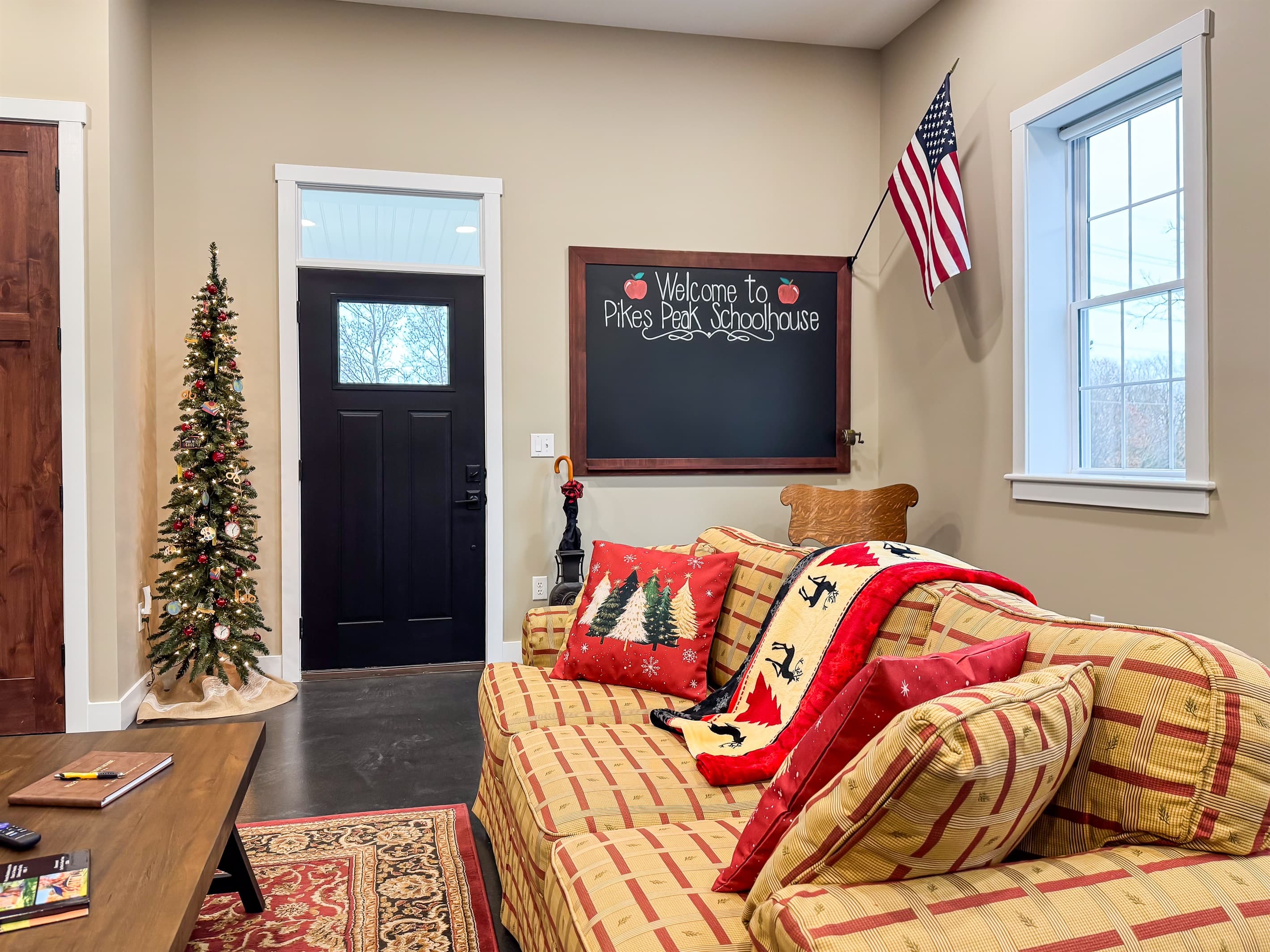 Comfy large couch in main living area decorated for the holidays.