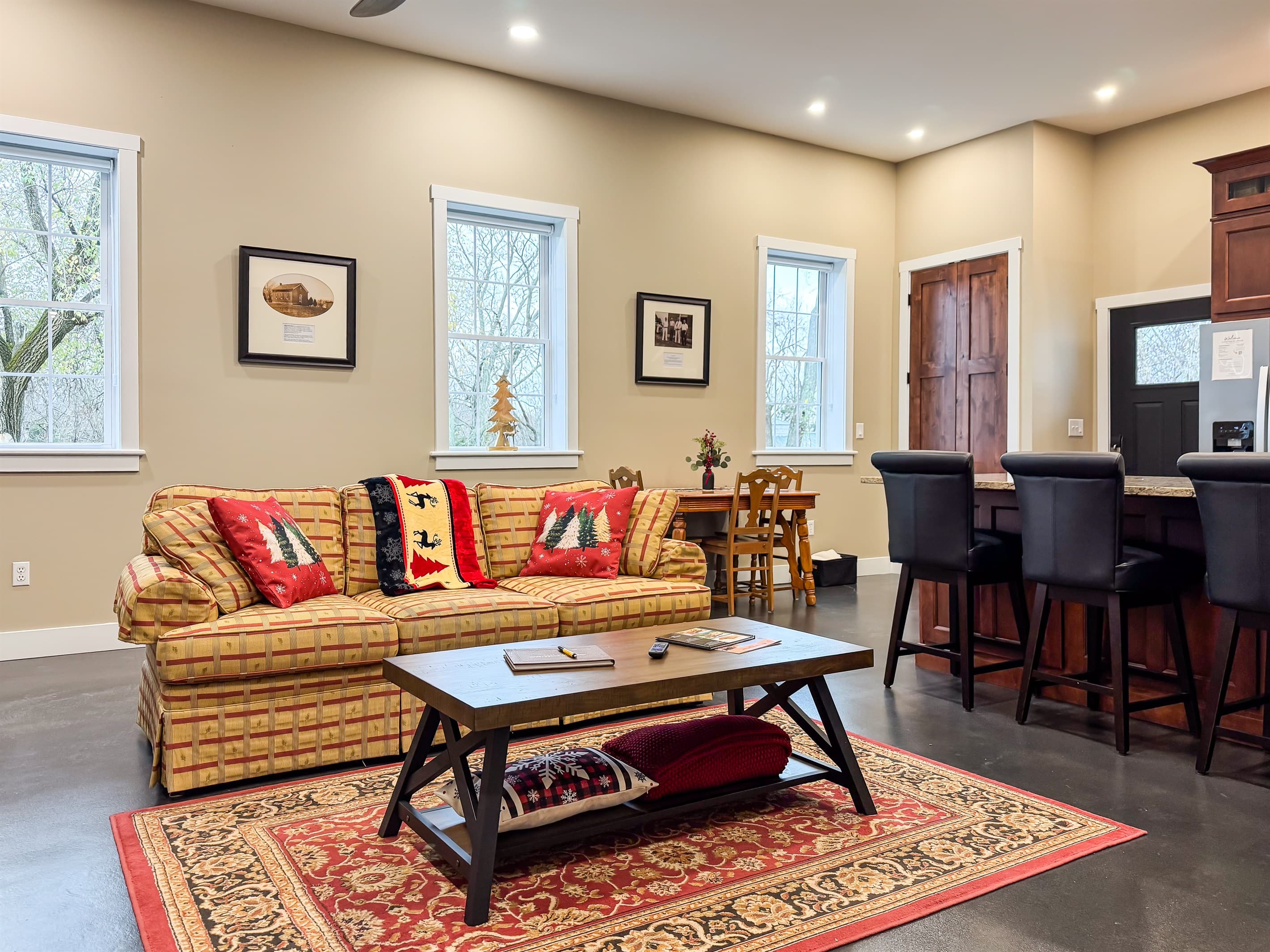 Bright and inviting living area with open concept kitchen and dining space.