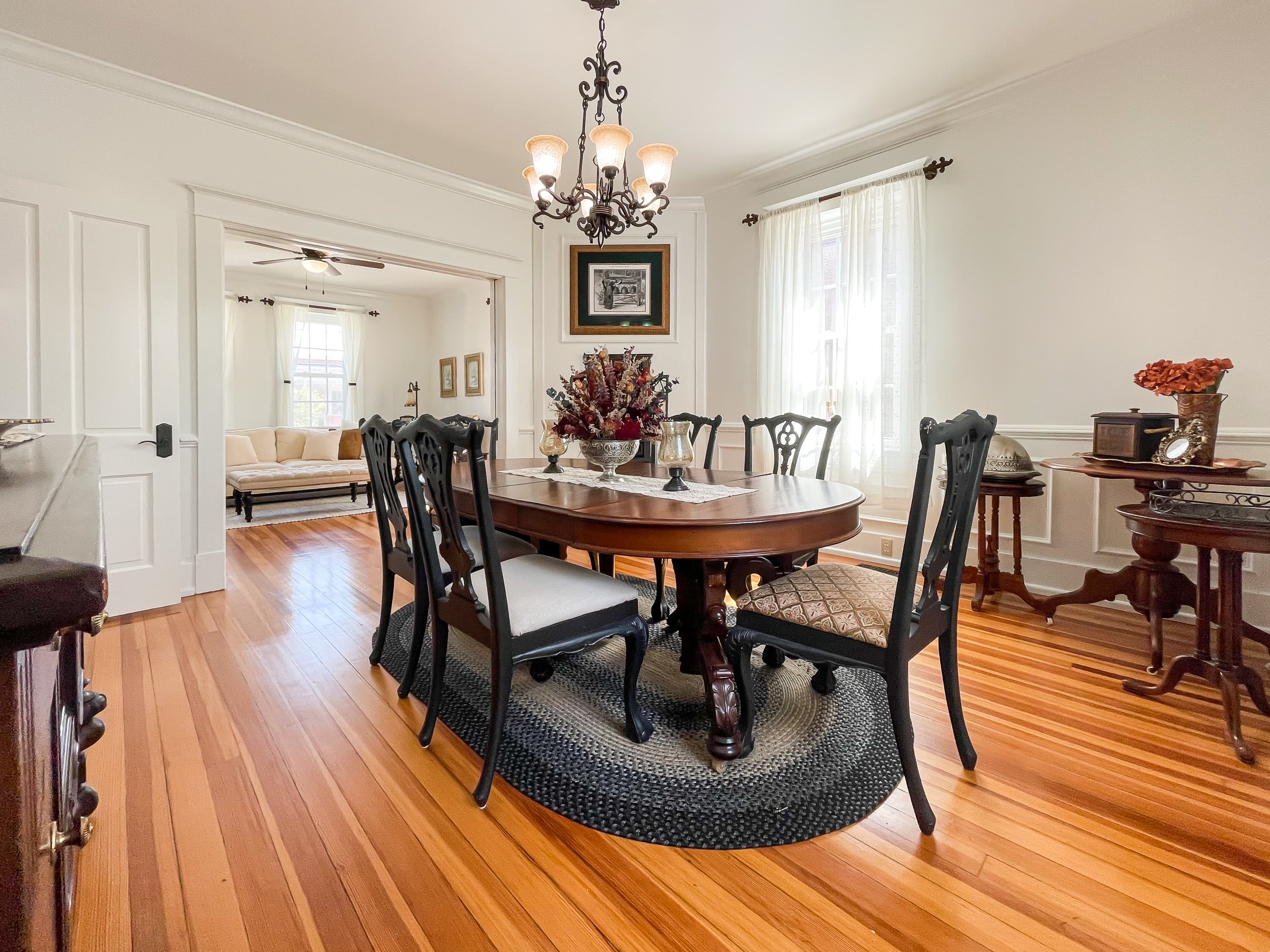 The large dining area at Bee's Knees (The Beekeeper's Cottage) includes a gorgeous hardwood dining table and seating for 6 people for family/friend dinners or game night.