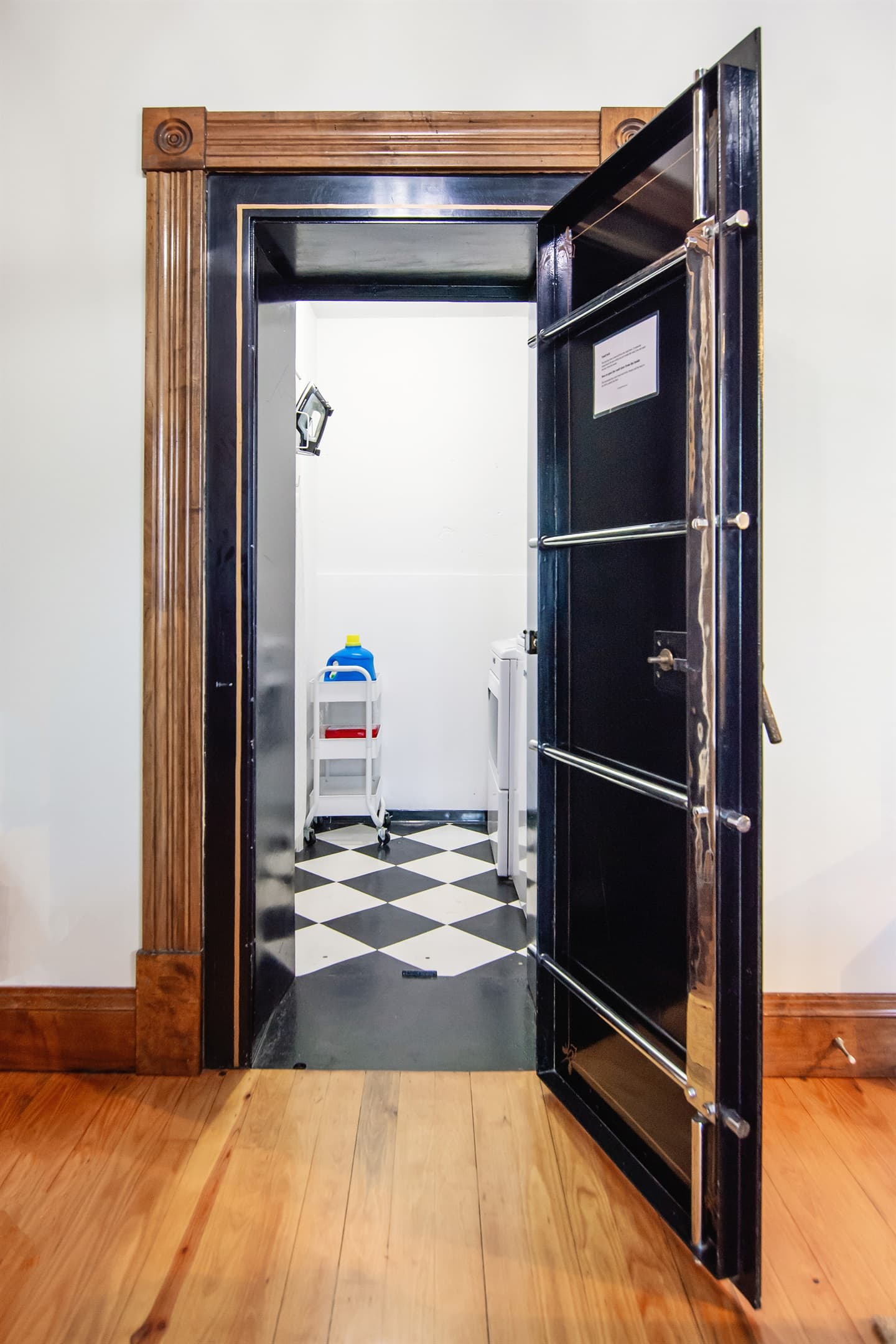 Main level original bank vault turned laundry room. The only place you can "launder" in a bank!
