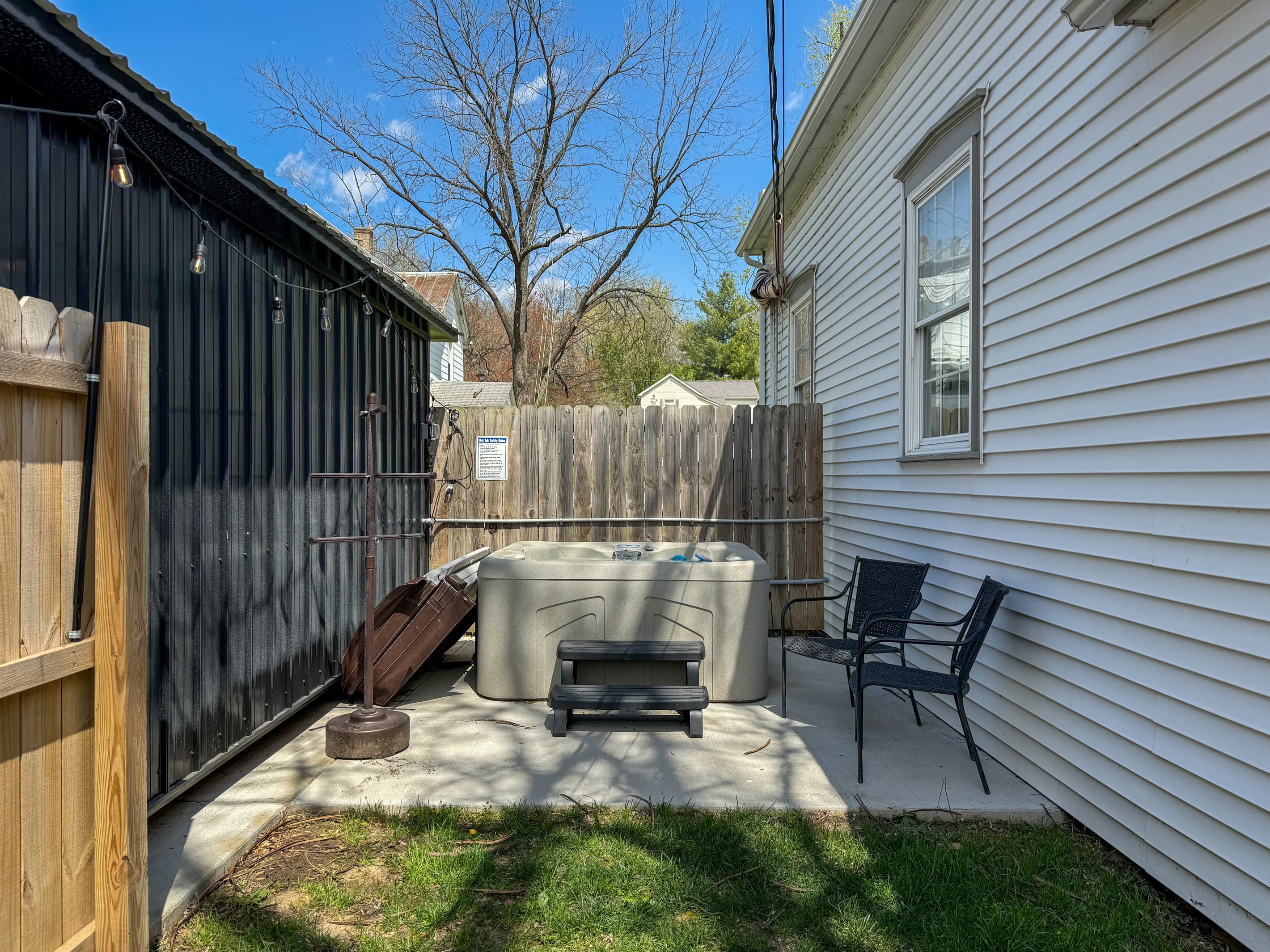 Private hot tub in fenced side yard