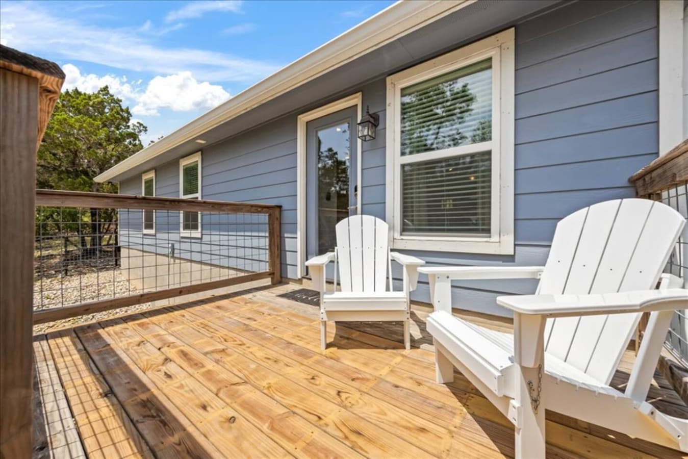 "Start your morning with coffee or wind down with a glass of wine on the front deck. These classic Adirondack chairs are the perfect perch for soaking in the peace and charm of the Hill Country."