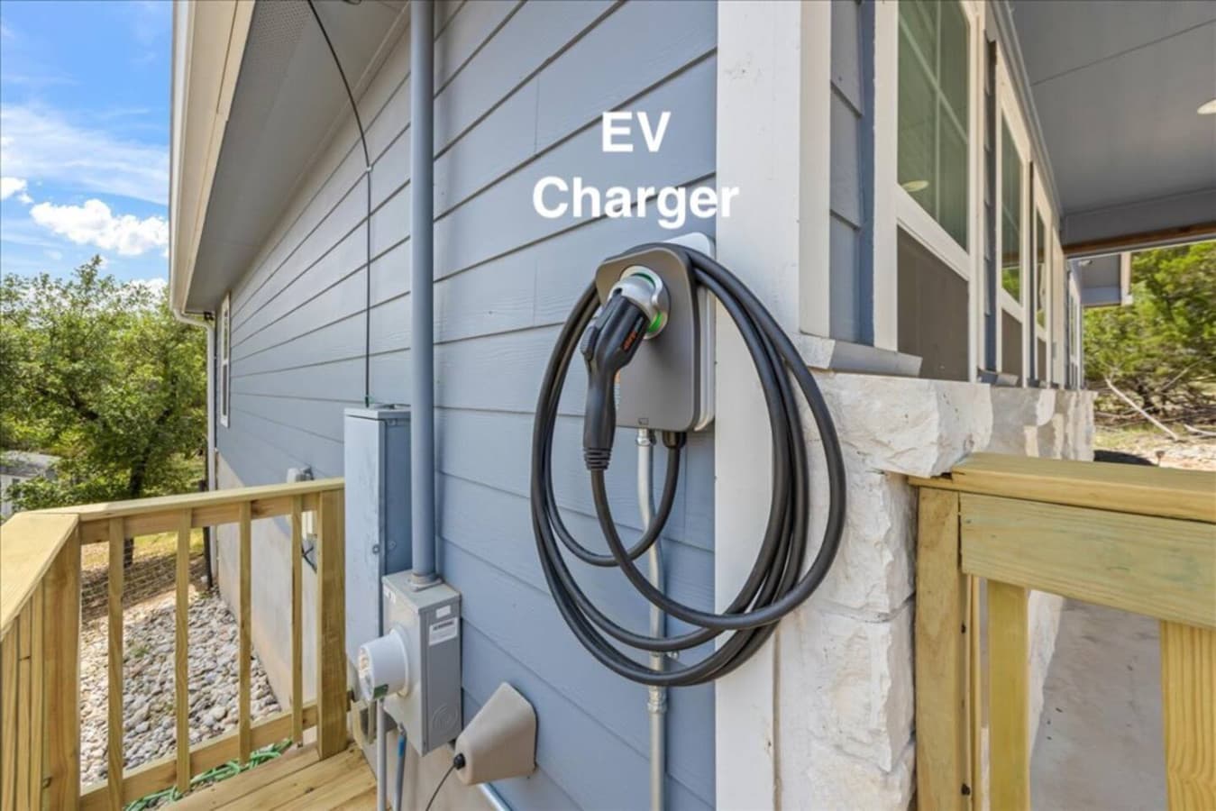"Drive electric with ease—our on-site EV charger makes it simple to power up during your stay. Conveniently located and Tesla-compatible with an adapter, it’s one more way we make your trip stress-free."