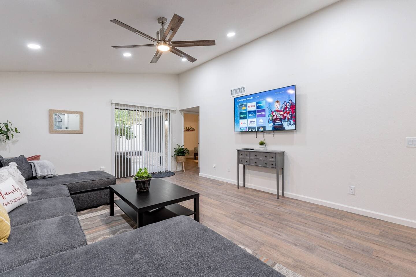 Perfect Escape - Living room with large 4k mounted tv and writing desk.