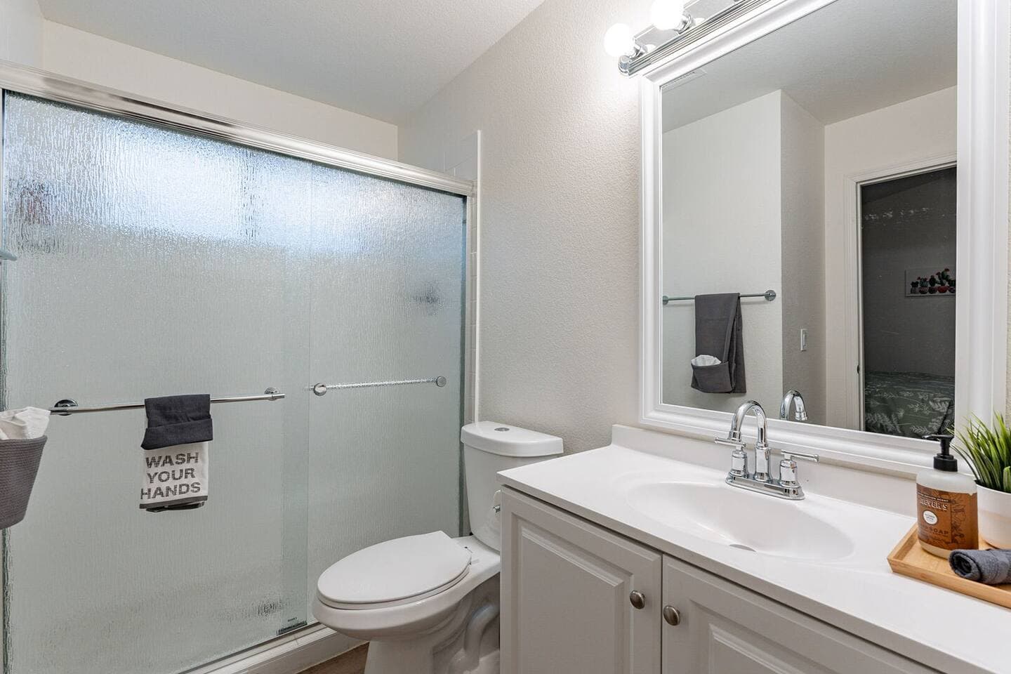 Perfect Escape - primary en-suite includes walk-in shower and blow dryer.