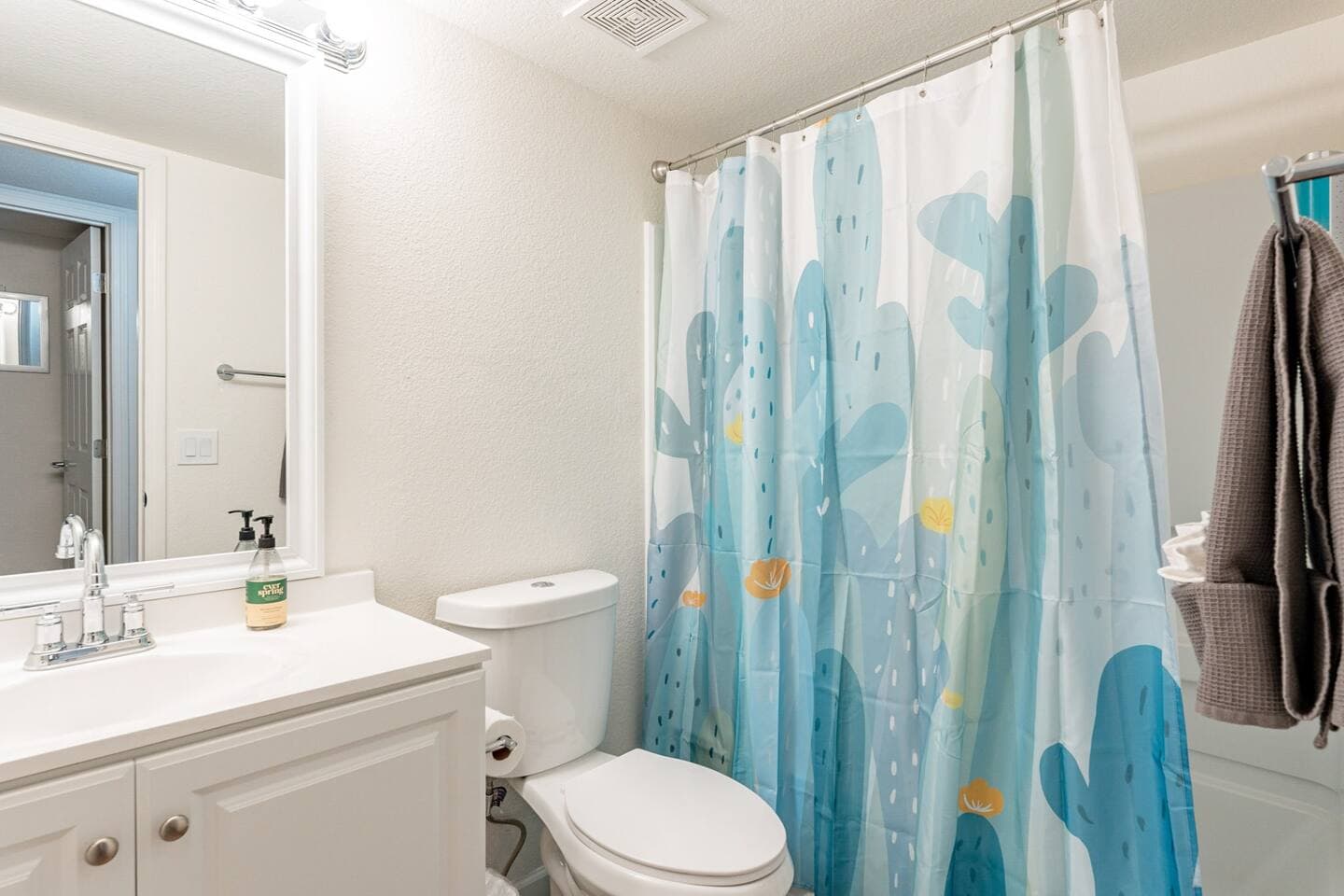 Perfect Escape - Bathroom two located directly next to bedrooms 2 and 3, tub/shower combo with blow dryer.