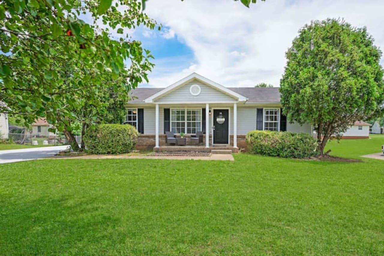 Spacious front yard with a porch.