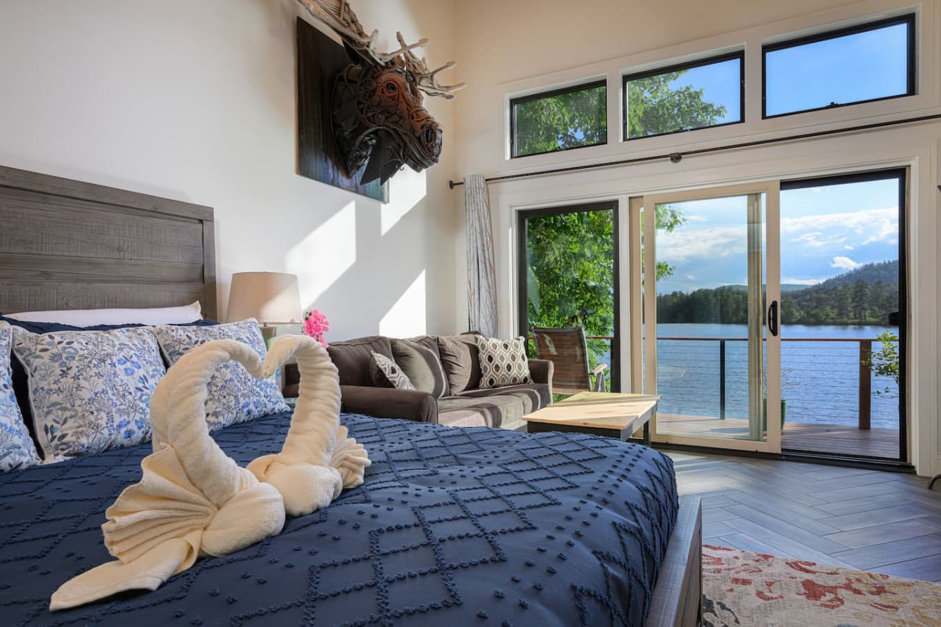 BEDROOM 1: Tucked on the 2nd floor, the primary suite is a private retreat designed for deep rest. Stretch out in the king bed, enjoy the pullout sofa for extra flexibility, and appreciate the ease of your own en-suite bath.
