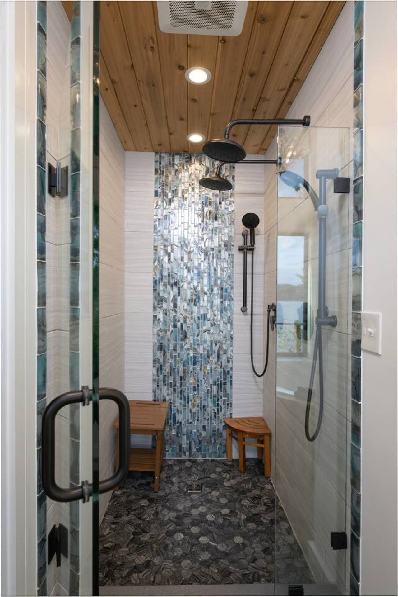 Designed for two, the oversized shower features dual rain and hand-held heads, making it easy to rinse off after a day of adventure and step into a warm, spa-like reset together.
