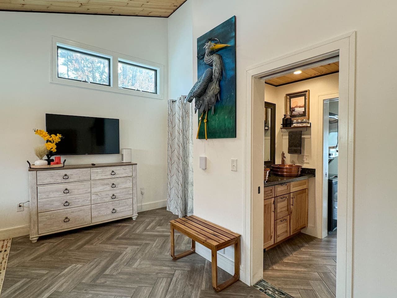 This room also features a striking blue heron sculpture created by a local college student from found plastics—an artful piece that celebrates both the beauty of wildlife and the creativity of sustainable design.