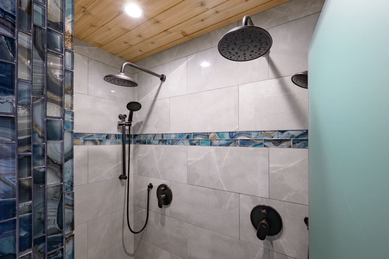 Connected directly to Bedroom 2, and shared with the 1st-floor, it also features a spacious two-person shower and private water closet—an ideal setup for families or groups sharing the first floor.