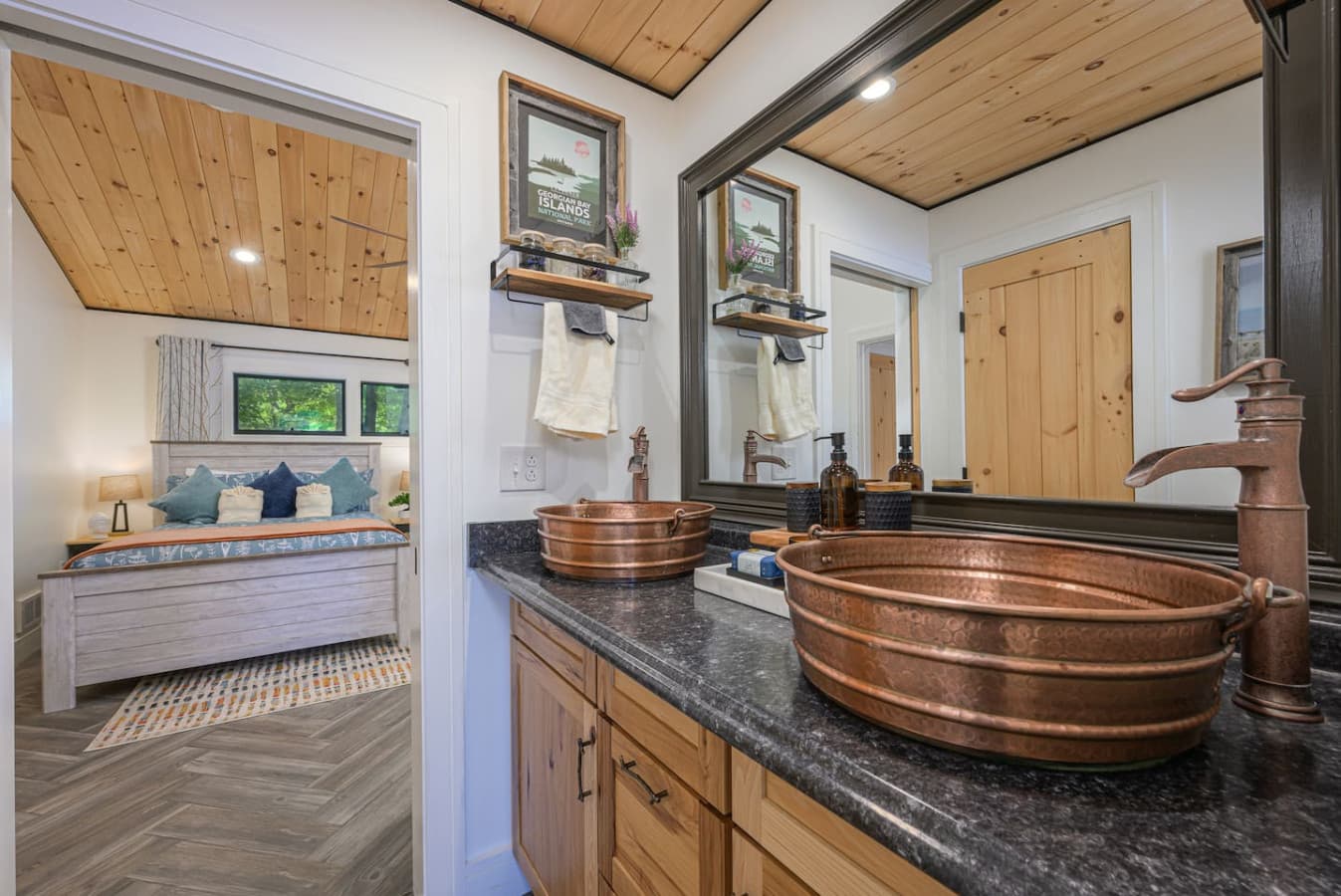 1ST-FLOOR BATH: Thoughtfully divided into separate spaces for the shower, toilet, and double vanity, this bathroom lets multiple guests get ready at once while still enjoying comfort, privacy, and an easy flow.