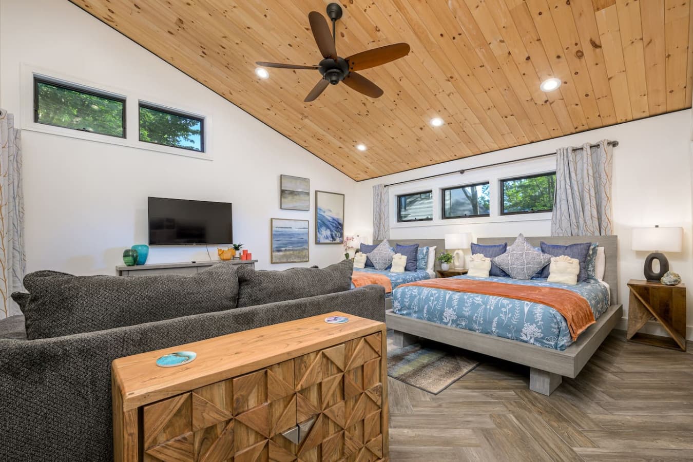 With 2 queen beds, a loveseat, privacy windows, and porch access, this room feels tucked away yet connected to the beauty outside. Step out in the morning and head straight toward the water for a peaceful start to the day.