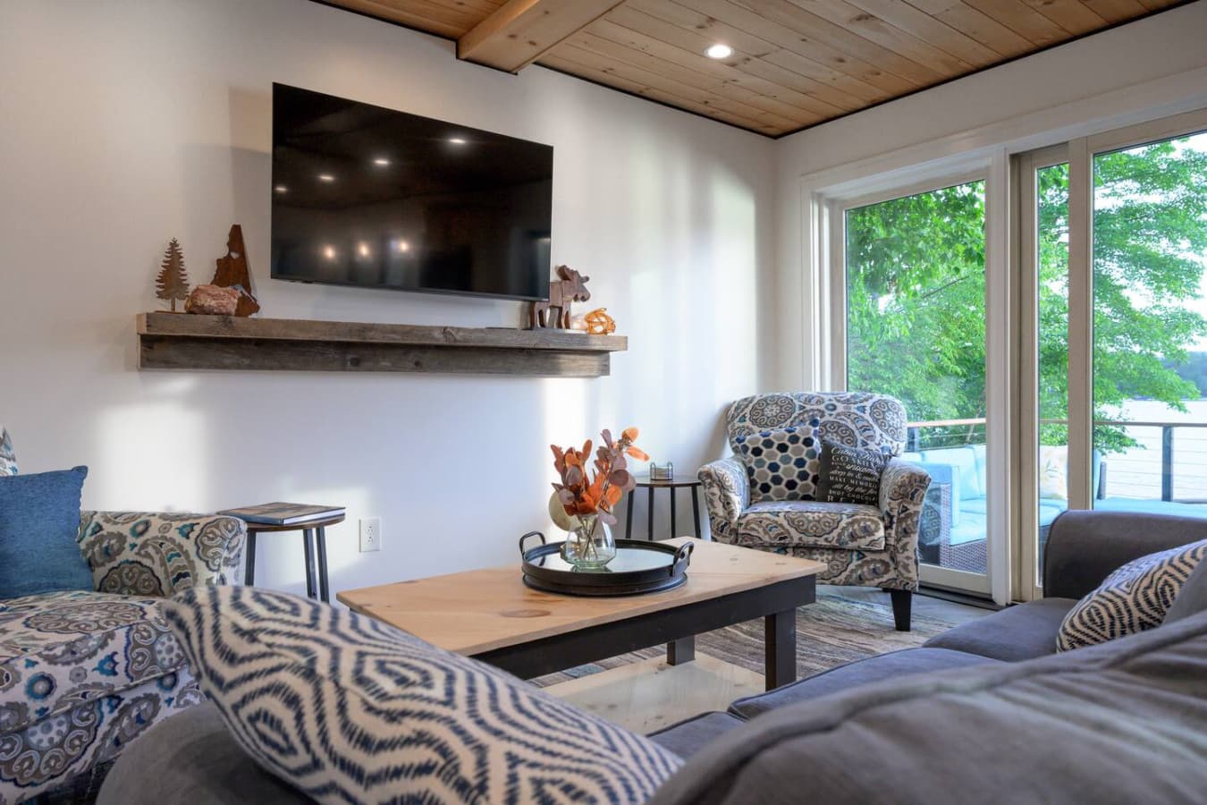 Cozy living room + big-screen TV, with a massive slider that leads directly to BBQ, hot tub, and the waterfront. Relax inside, play outside—repeat.