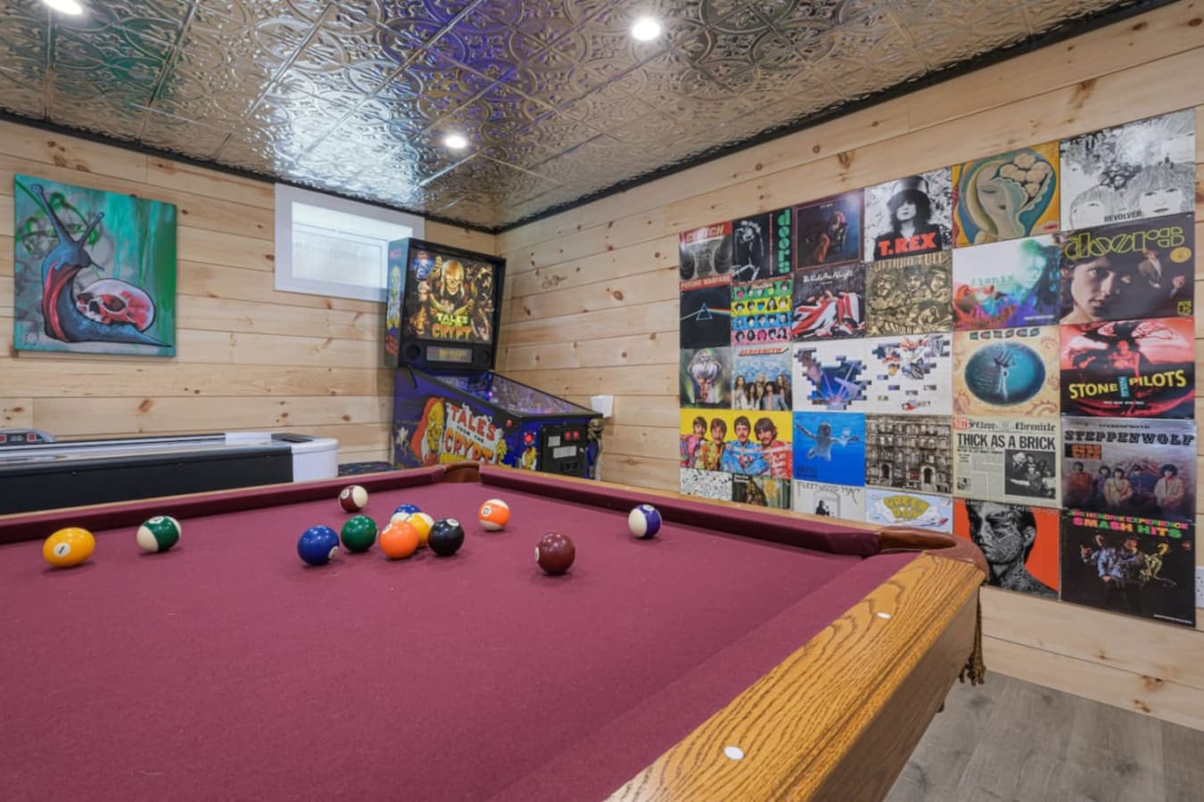 Whether you’re starting a pool tournament, battling it out at air hockey, or chasing a high score on classic pinball, this is the kind of space that keeps your group laughing, playing, and making memories together. *Nirvana album art contains nudity*