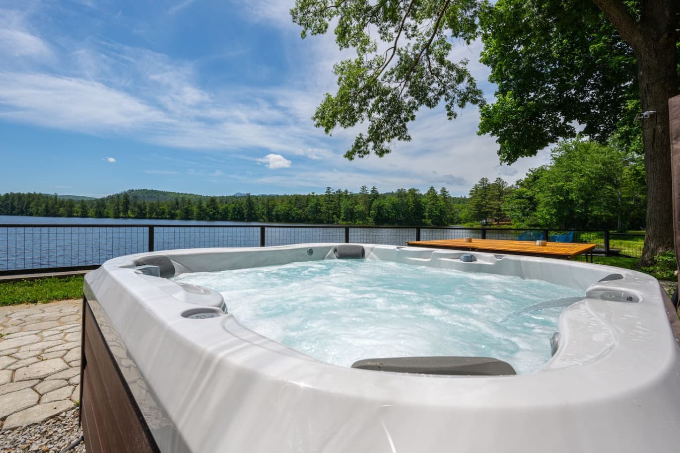 Relax in the hot tub with sweeping water & mountain views—the perfect place to warm up after a day of adventure, sip a drink at sunset, or unwind under the stars. Hot tip: turning off all lights makes the stars more visible & helps cut down on bugs.