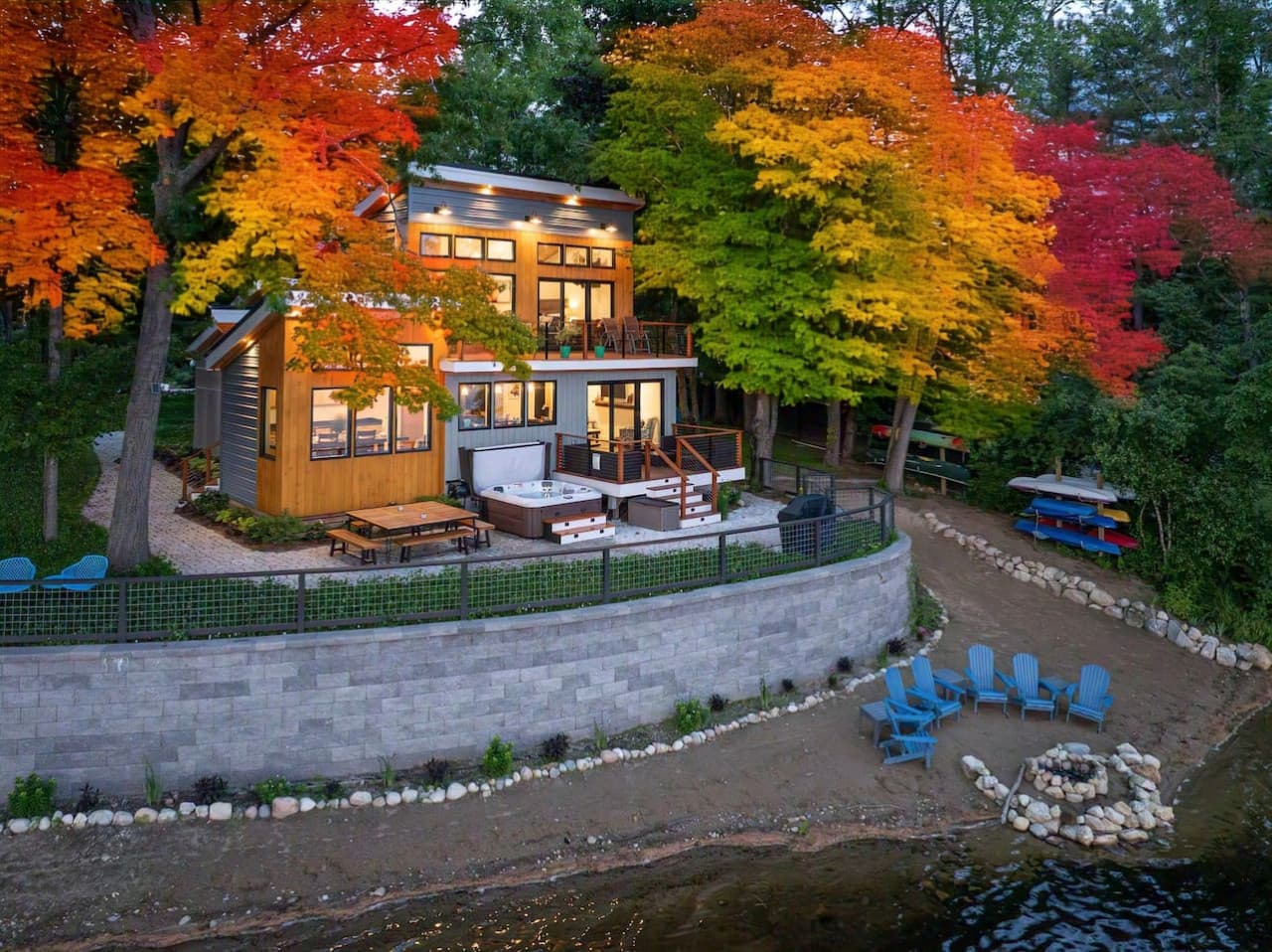 Wrapped in brilliant fall color, our home feels like a true New England escape—modern architecture, warm wood tones, and a waterfront setting that’s especially magical in autumn.