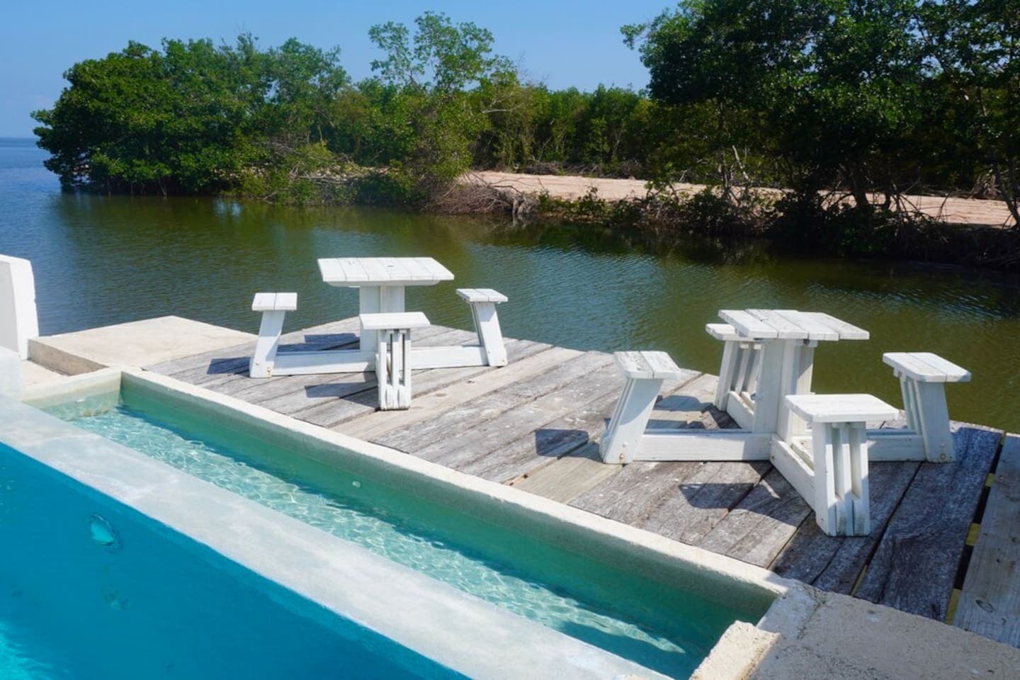 infinity pool and overwater deck overlooking the beautiful Caribbean Sea