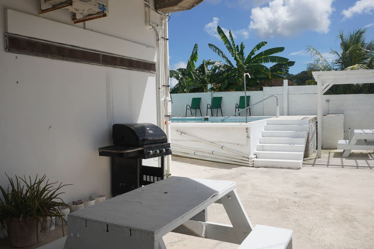 poolside pergola terrace with picnic tables