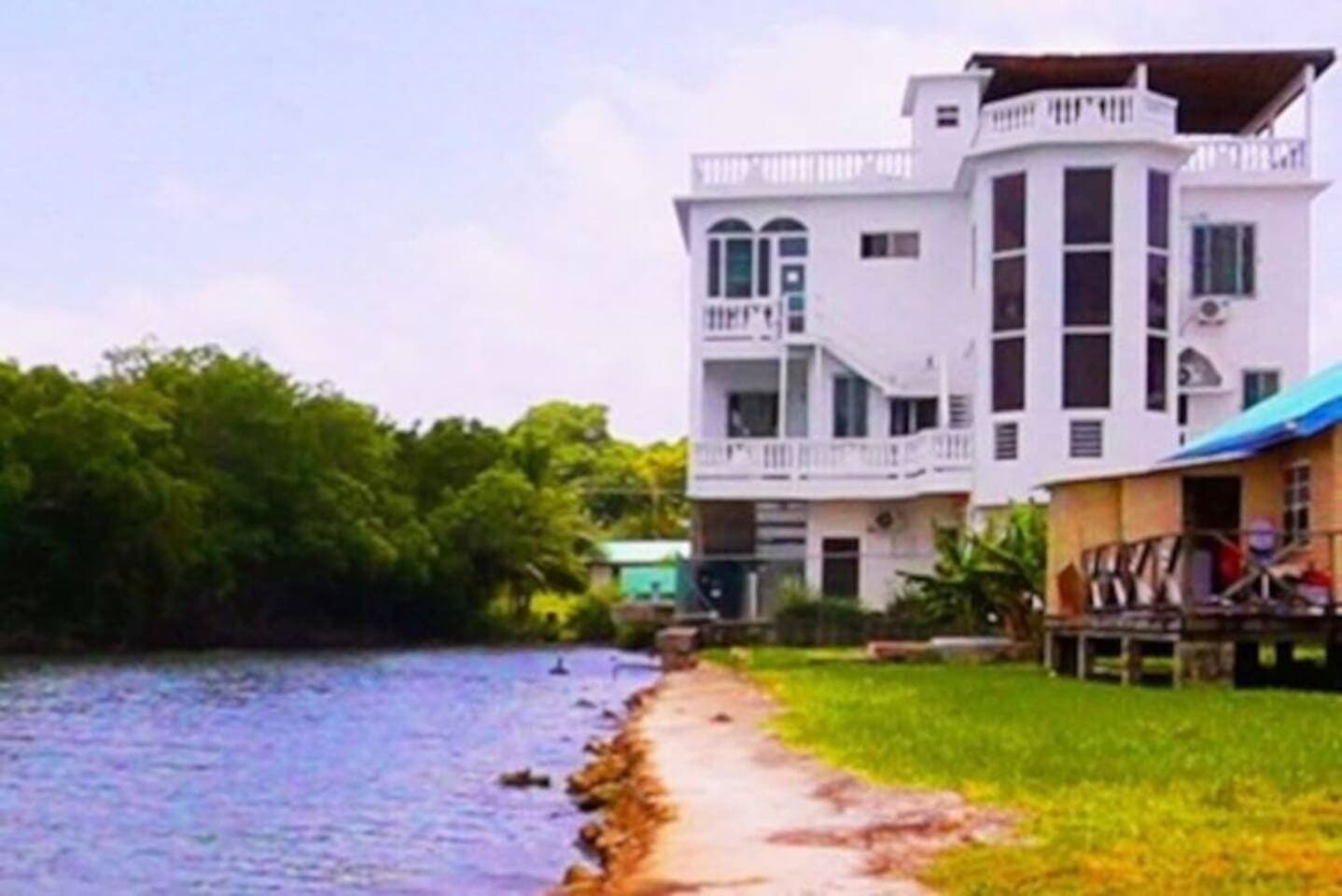 Relax in this spacious, ground floor, Sea View studio located within this stylish Sea View waterside villa overlooking the breathtaking Caribbean Sea and lush mangrove forest!