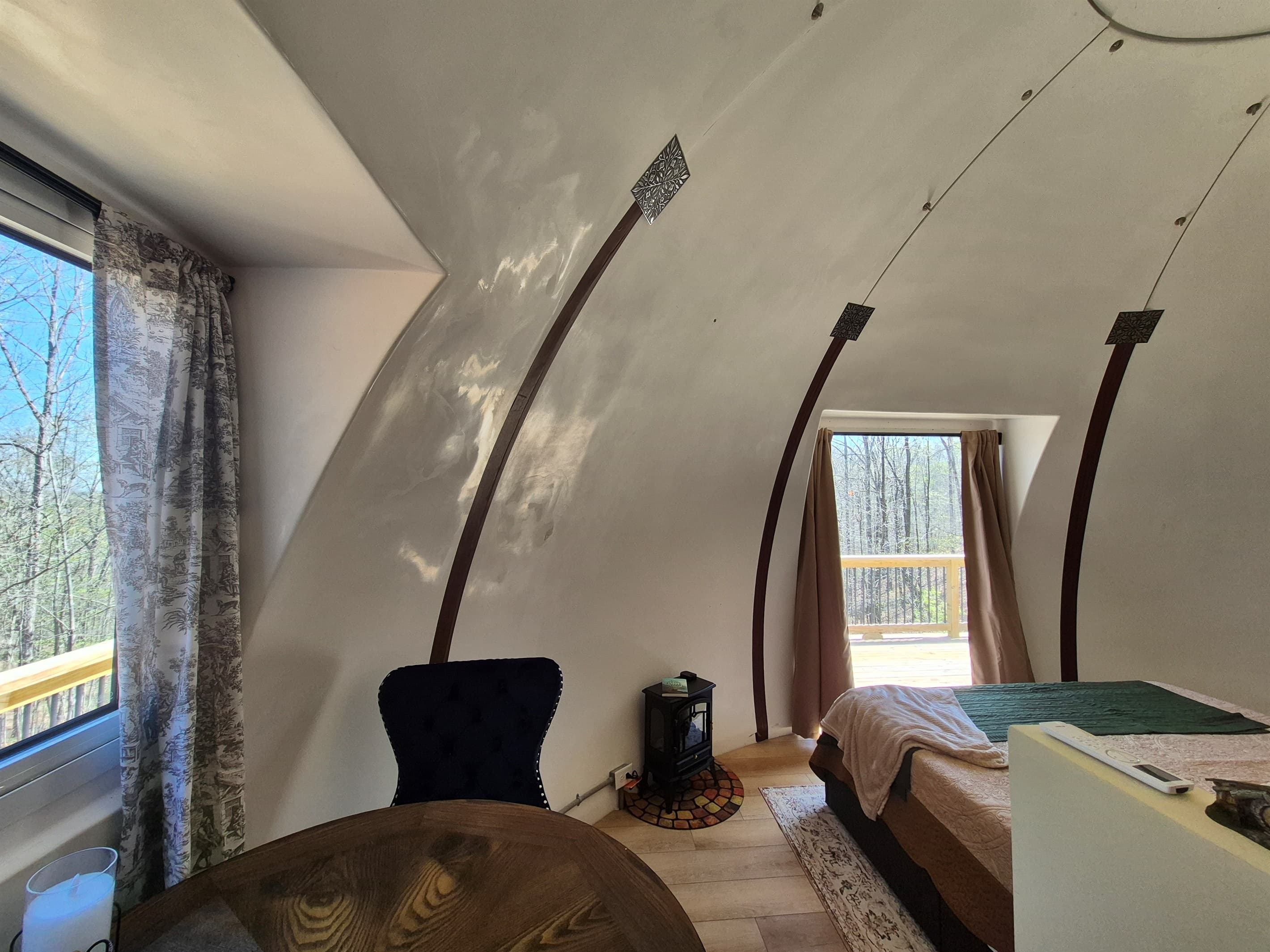 Eating area for 2 with bright window view of the surrounding woods