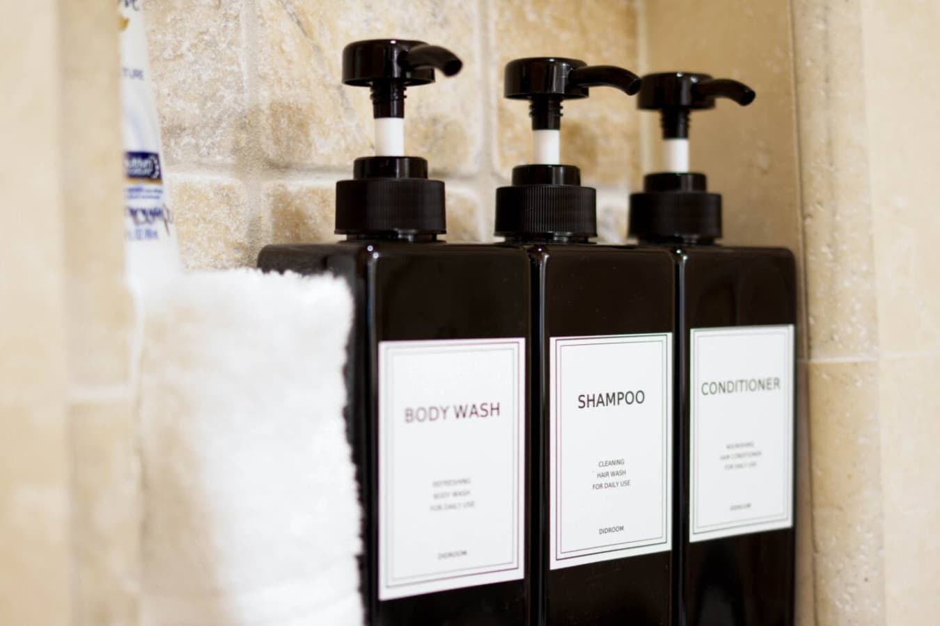 Bath essentials neatly arranged in the shower for a convenient stay