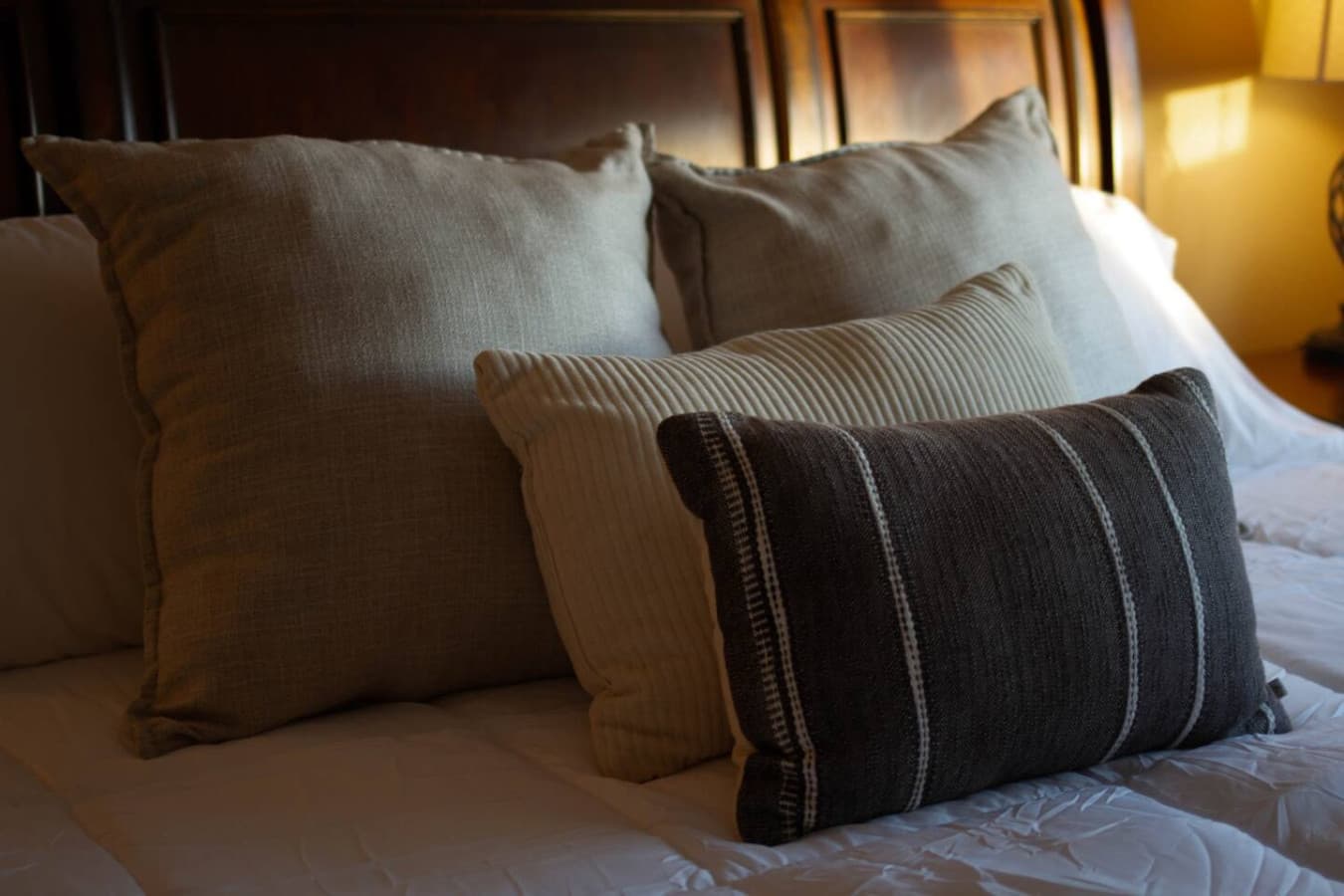 Layered pillows & crisp bedding detail, a small comfort that makes turning in easy.