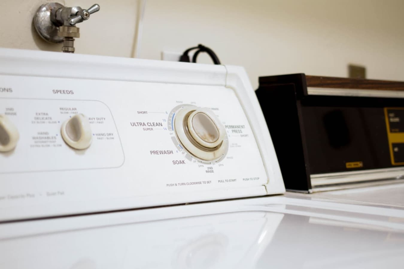 Laundry detail w/ full-size washer & dryer on site for easy mid-stay refreshes.