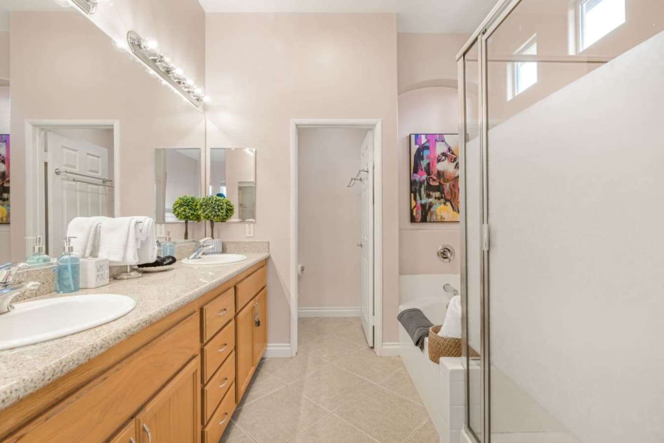 Bathroom vanity w/ sink, mirror, and clean finishes for a fresh start or easy evenings in.
