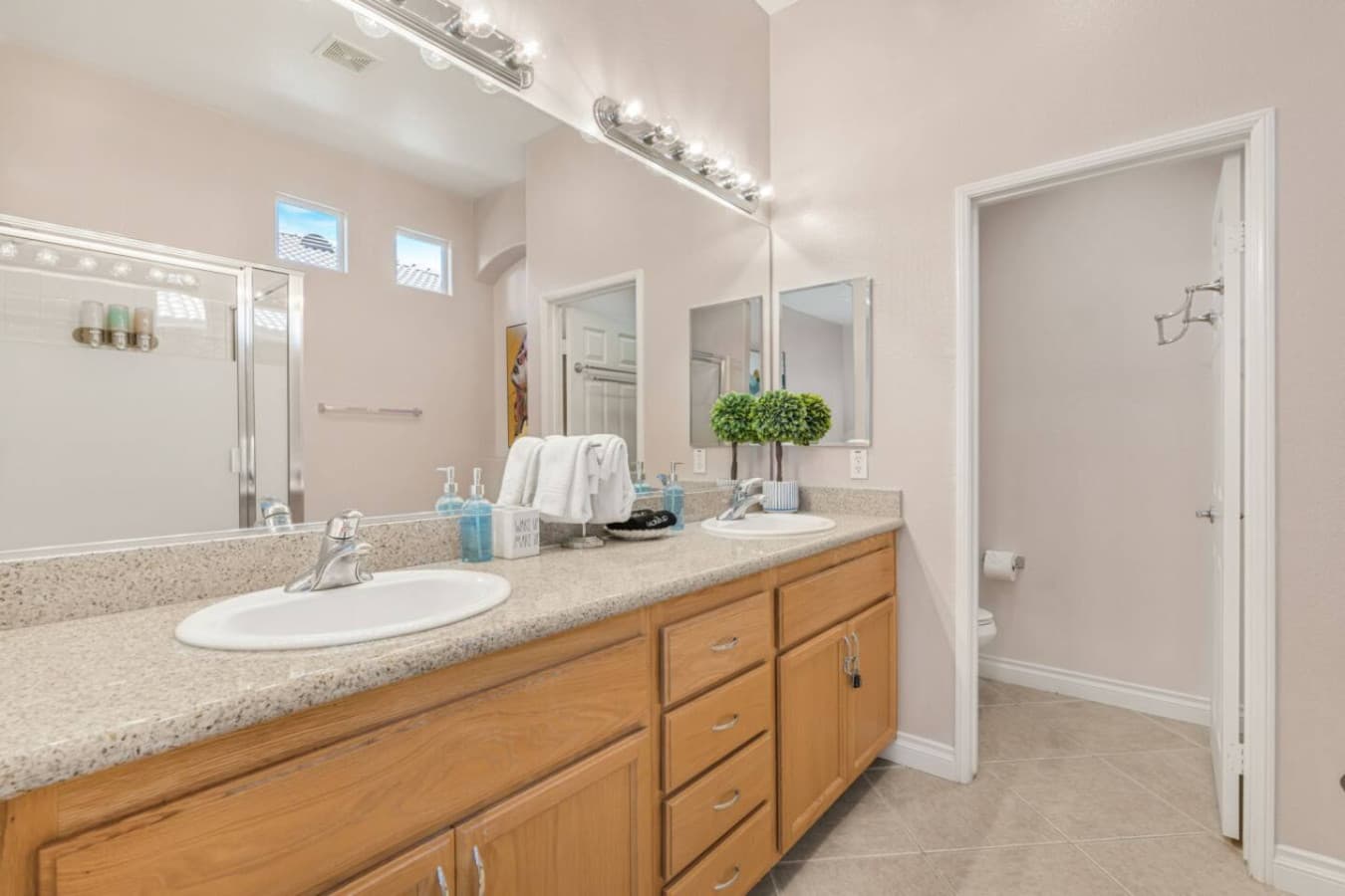 Additional bathroom angle showing a bright, functional layout w/ plenty of counter space.