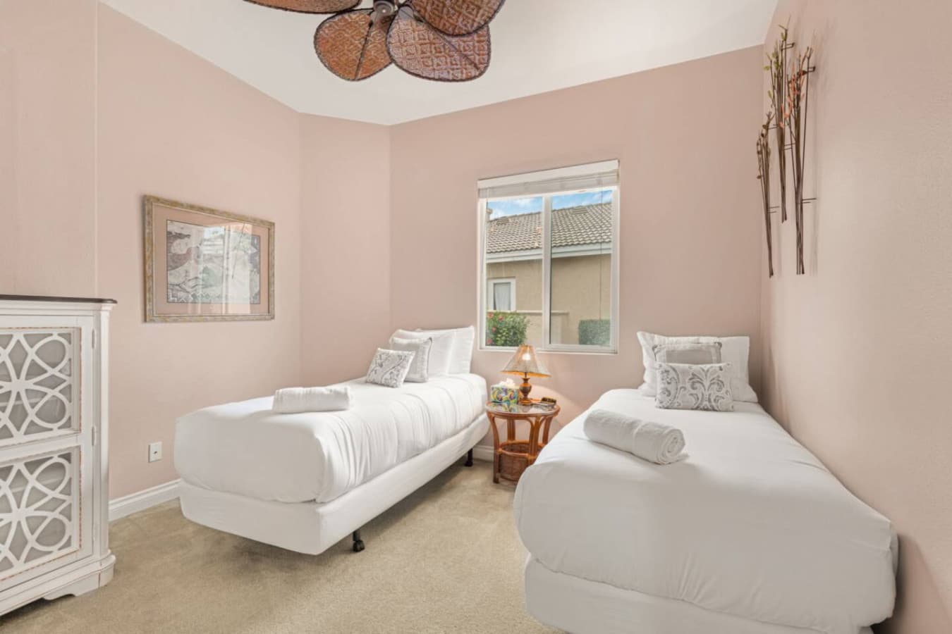 Cozy bedroom w/ two beds, soft neutral colors, and a calm space ideal for rest and recharge.