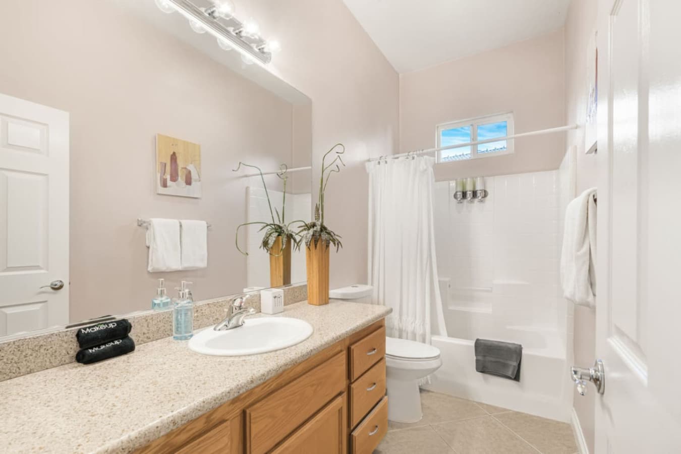 Another bathroom angle showing a well-lit vanity area designed for convenience and comfort.
