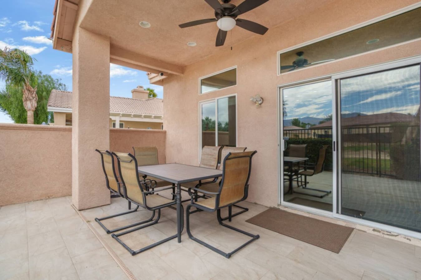 Covered patio w/ outdoor seating, perfect for morning coffee or evening hangs in the fresh air.