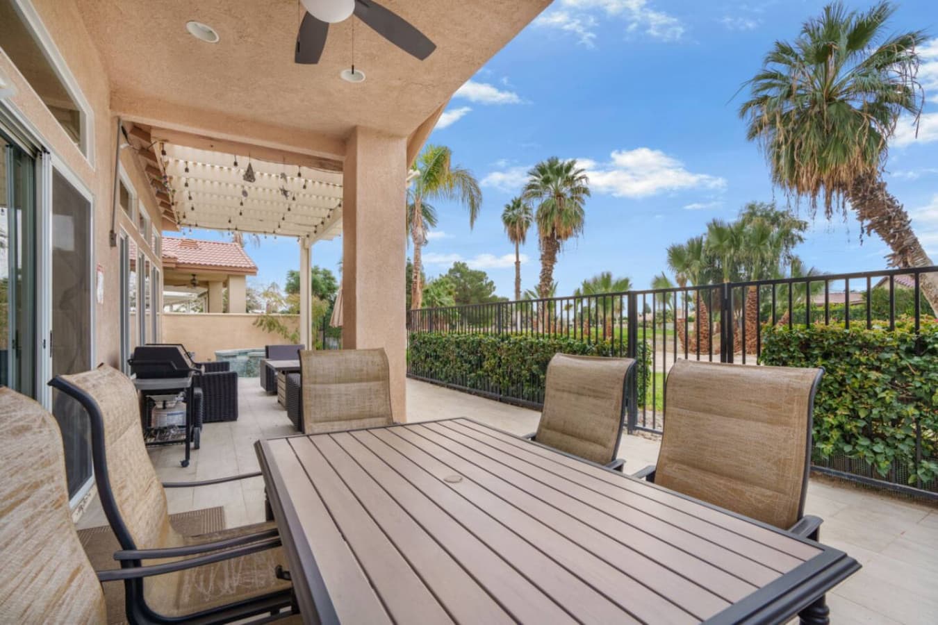Covered patio w/ outdoor seating, perfect for morning coffee or evening hangs in the fresh air.