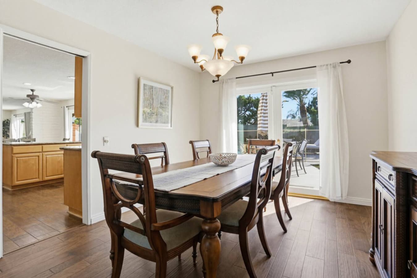 Dining area w/ table & sliding doors opening to outdoor views