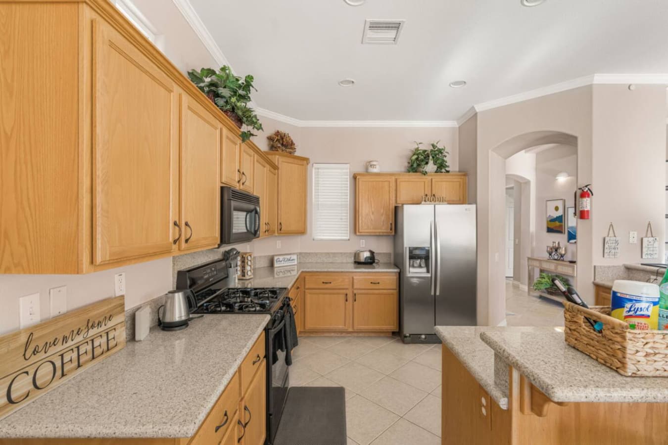 Functional kitchen w/ ample counter space and cabinetry for cooking and everyday convenience.