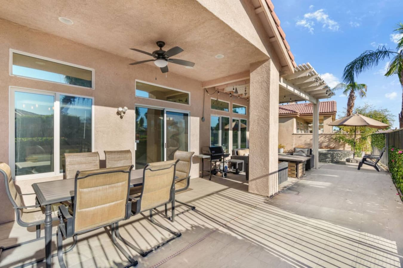 Covered patio w/ outdoor seating, perfect for morning coffee or evening hangs in the fresh air.