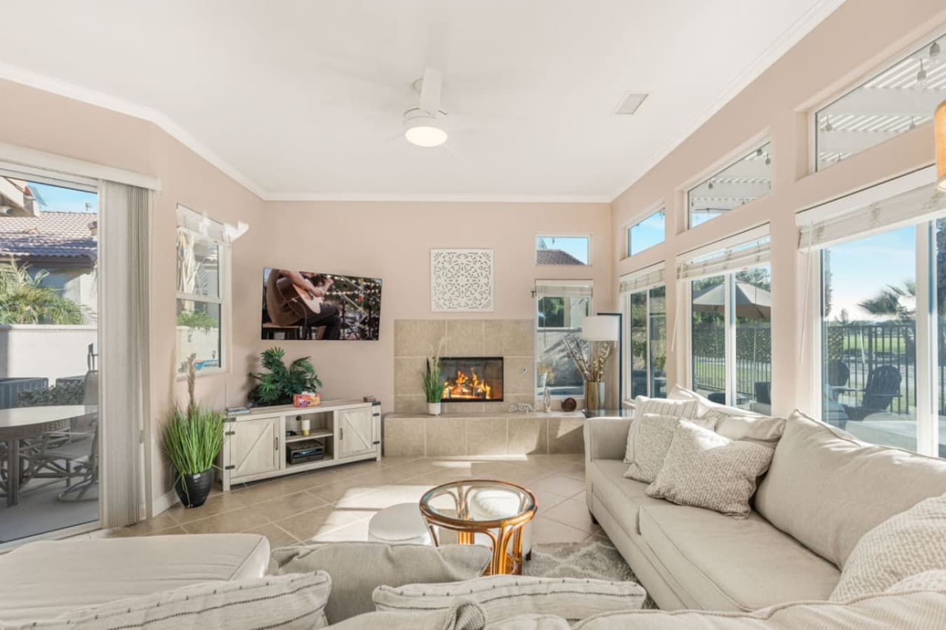 Bright open living room w/ comfy seating, natural light, and easy flow for relaxing or gathering together.