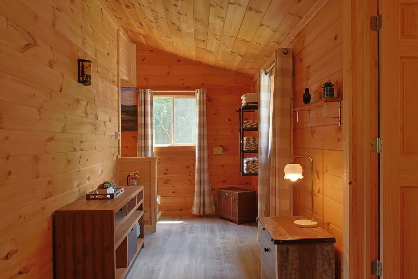 A spacious hallway by the bedrooms with thoughtful decor