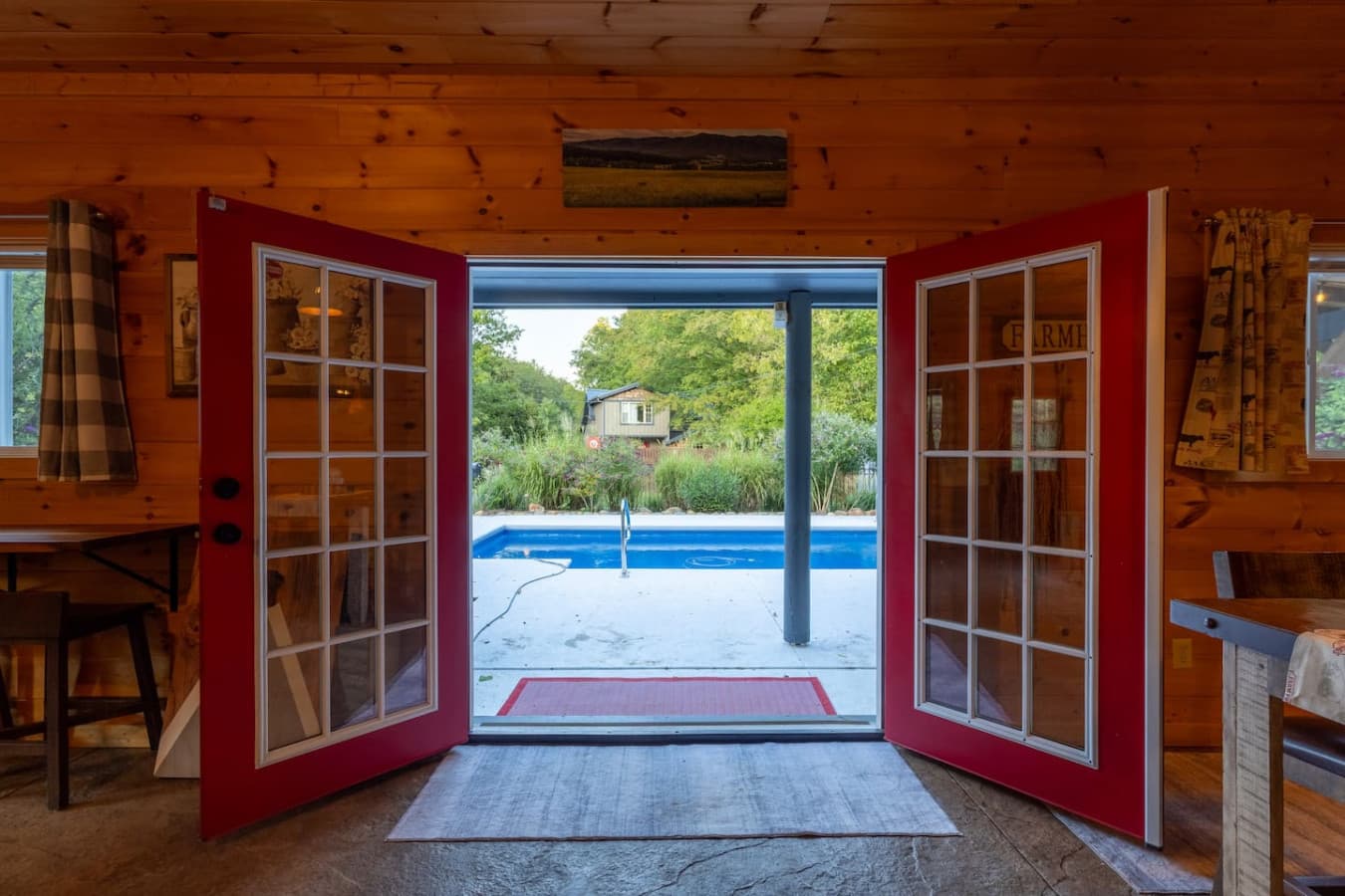 The View from Above: Take in the sights of the pool and the surrounding woods from your private outdoor lounge area.
