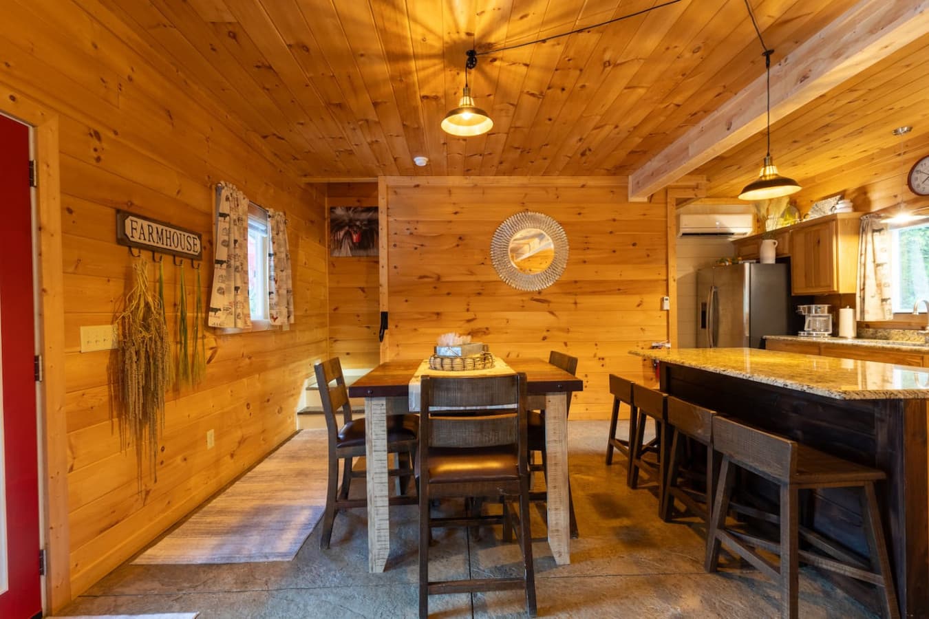 Shared Meals: A spacious dining table set for a farm-to-table dinner, positioned right off the kitchen for easy serving.