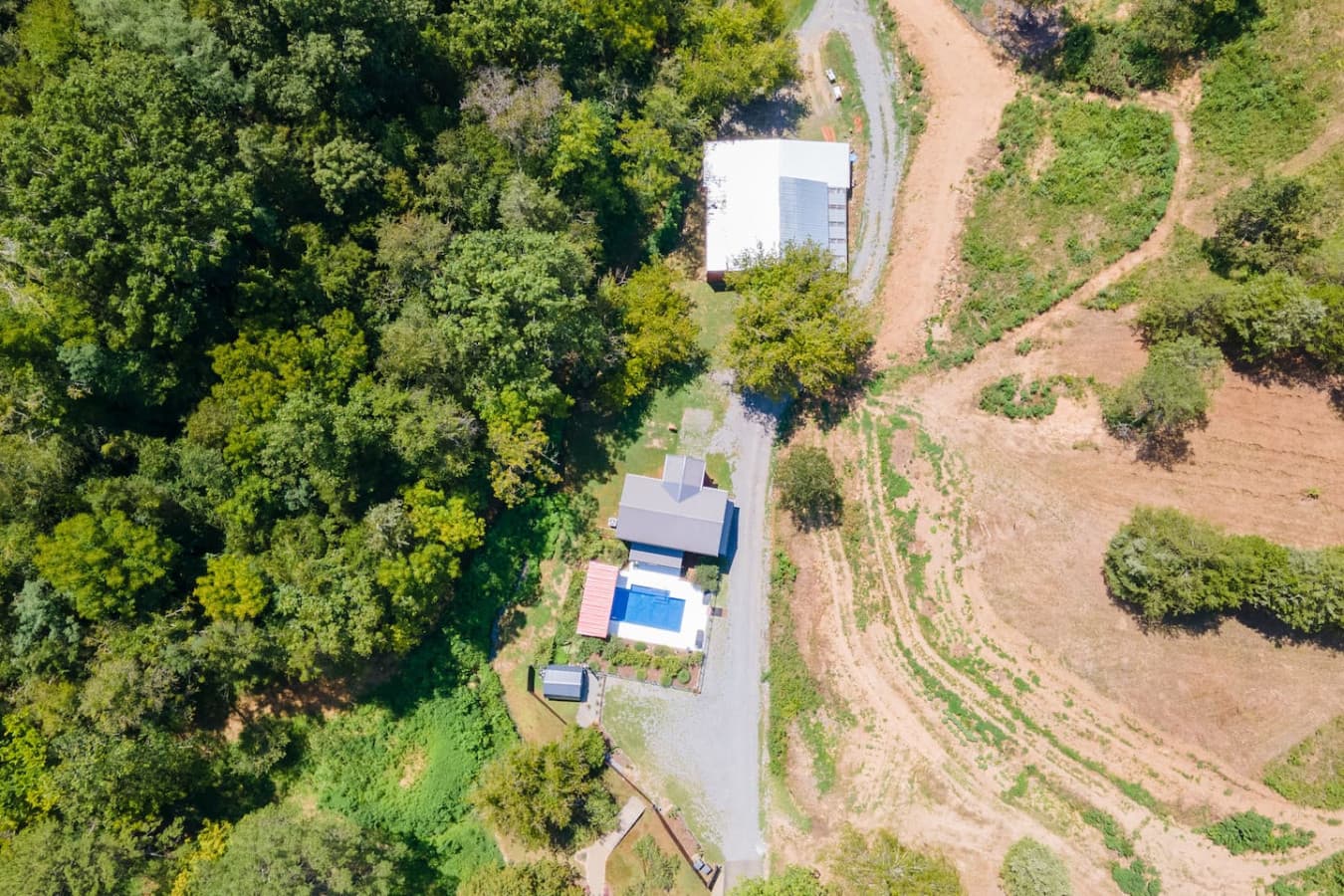 Acres to Explore: An aerial view showing the vastness of the property and its private trails.