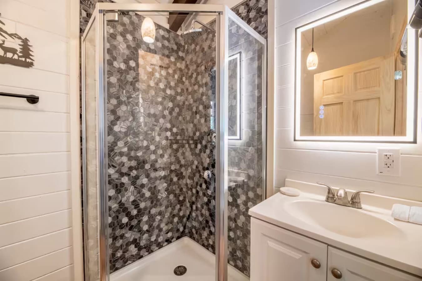 Modern fixtures meet rustic charm in our well-appointed main bathroom.